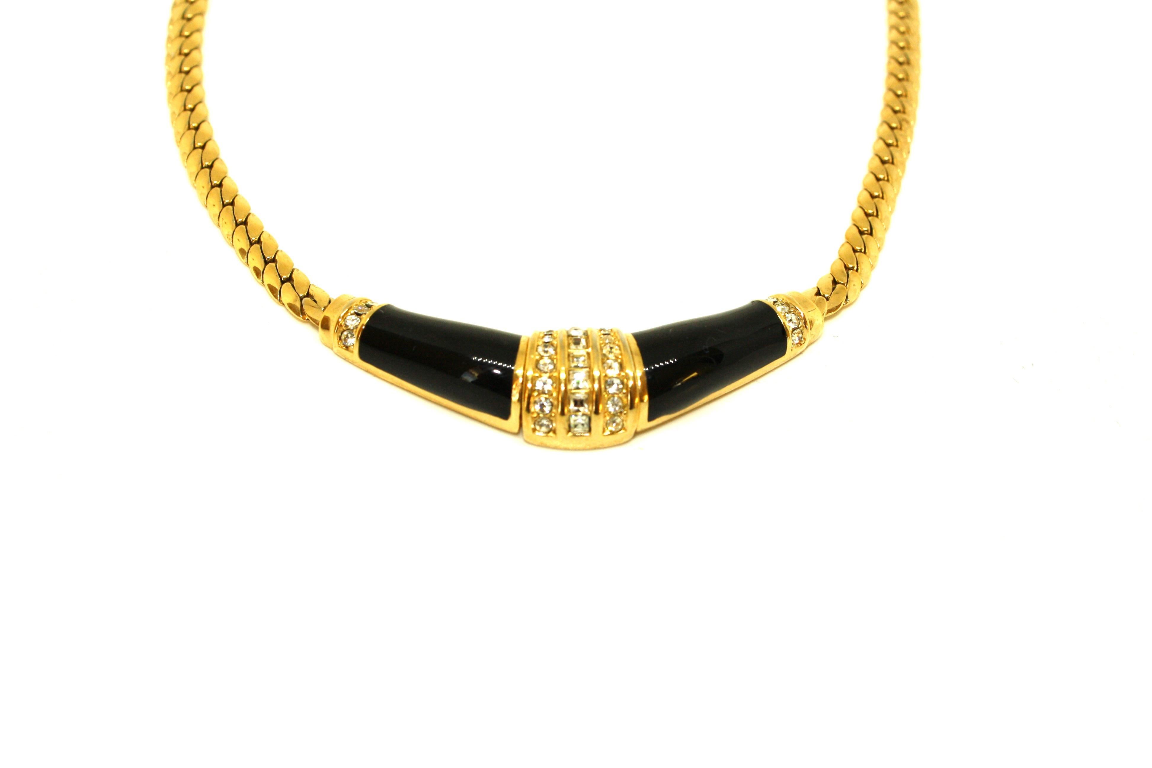 Dated to the 1980's, this fabulous necklace by Christian Dior will add a sophisticated and glamorous touch to any outfit. The black enamel is complimented by small glittering white diamante round and square stones.  The extension chain means it can