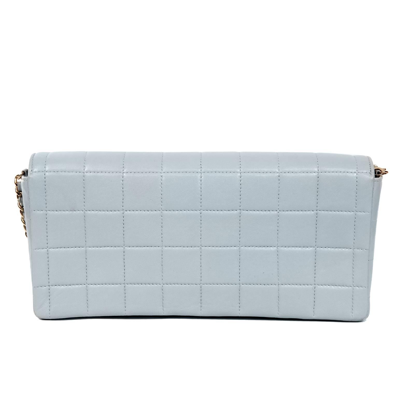 Chanel Light Blue Leather East West Flap Bag- Excellent Plus Condition
 Simply designed with an optional shoulder strap, the unique color and square quilting makes it a stand out piece.
Pale blue leather is quilted in square pattern with gold