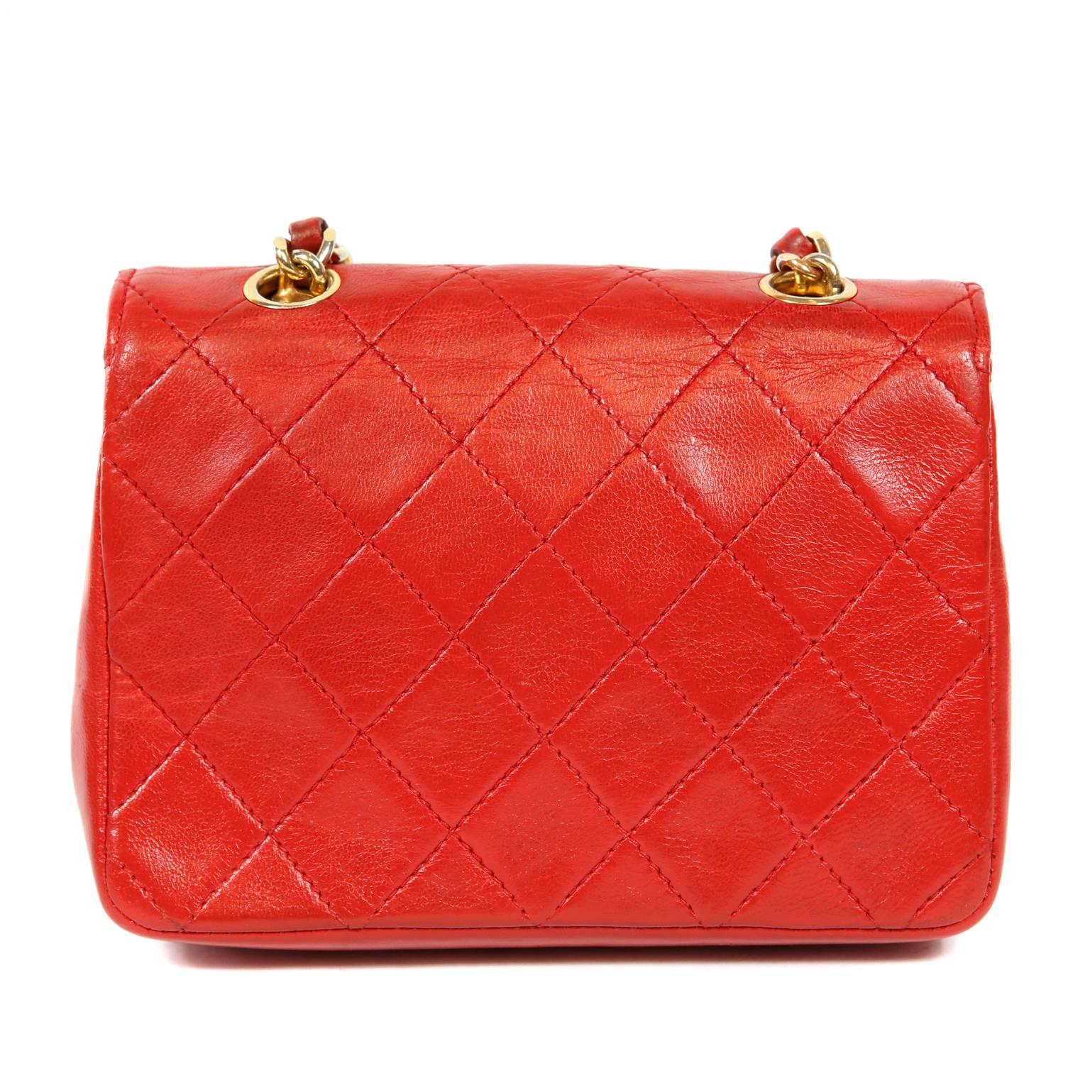 Chanel Vintage Red Leather Mini Classic- EXCELLENT PLUS Condition
  A truly stunning piece featuring a jewelry clasp depicting (what else?) a gold quilted Chanel flap bag.
Lipstick red leather is quilted in signature Chanel diamond pattern.  Gold