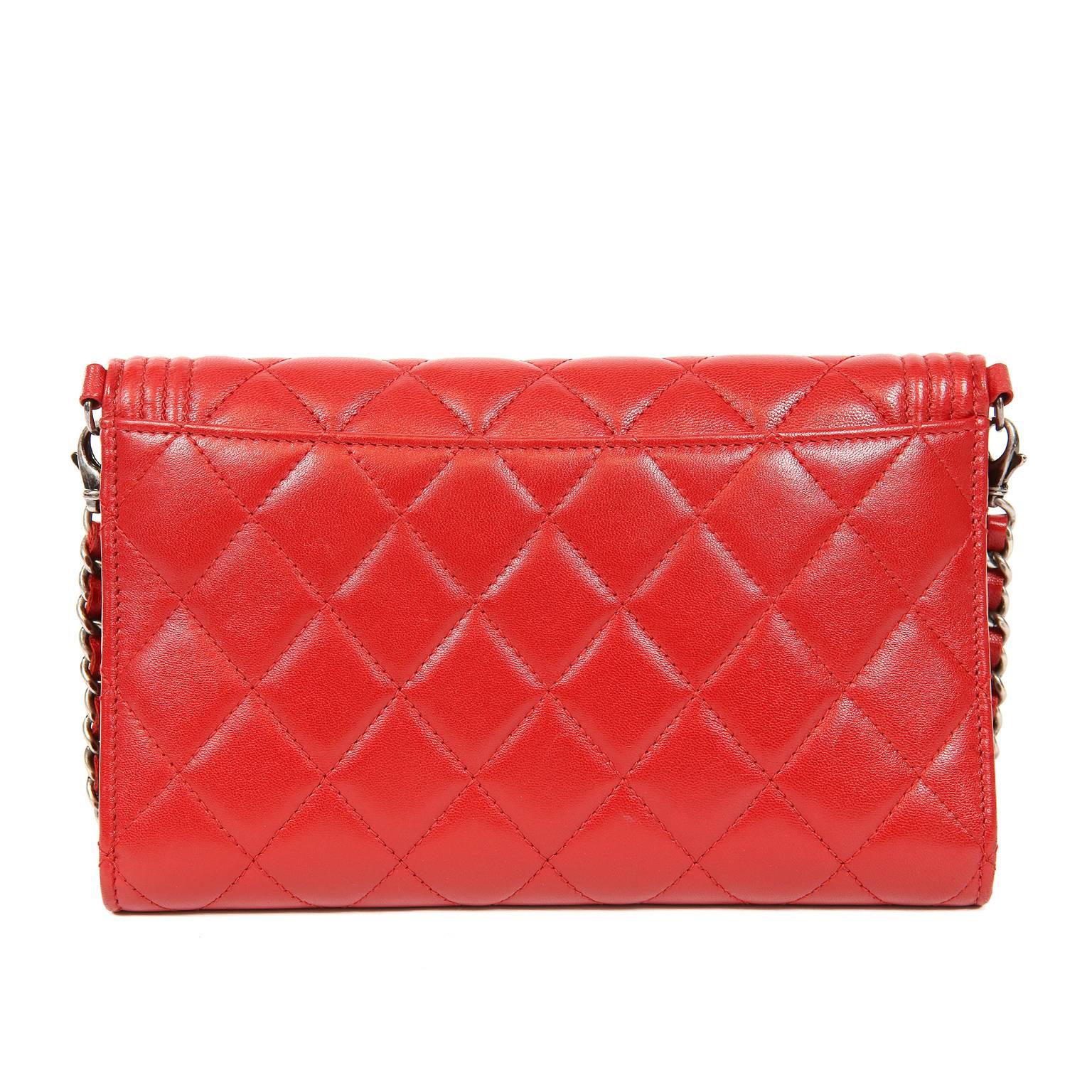 Chanel Red Leather Boy Bag Clutch with Chain- MINT
Timeless and versatile, Chanel’s updated Boy Bag Clutch is a brilliant piece for any collection.  Lipstick red leather is quilted in signature Chanel diamond stitched pattern.  Boy Bag welted frame