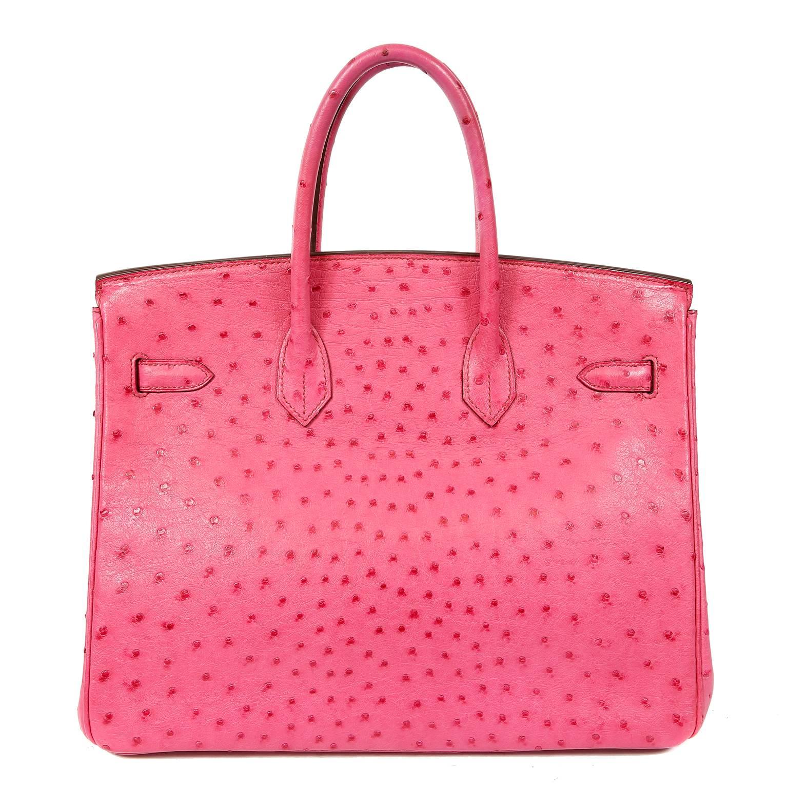 Hermès Pink Ostrich 35 cm Birkin Bag- MINT
 The ultimate luxury item the world over, Hermès Birkins are hand stitched by skilled craftsmen.  Wait lists of a year or more are commonplace for the bovine versions.  This particular Birkin is in Pink