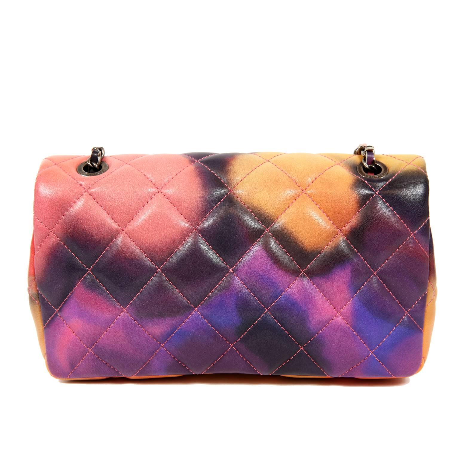 Chanel Printed Watercolor Mini Classic Flap- PRISTINE; Never Carried Special Edition from the Spring 2015 Collection
Bright and beautiful, this artistic rendition of the classic is a must have for any collector. 
Shades of pink, orange, yellow and