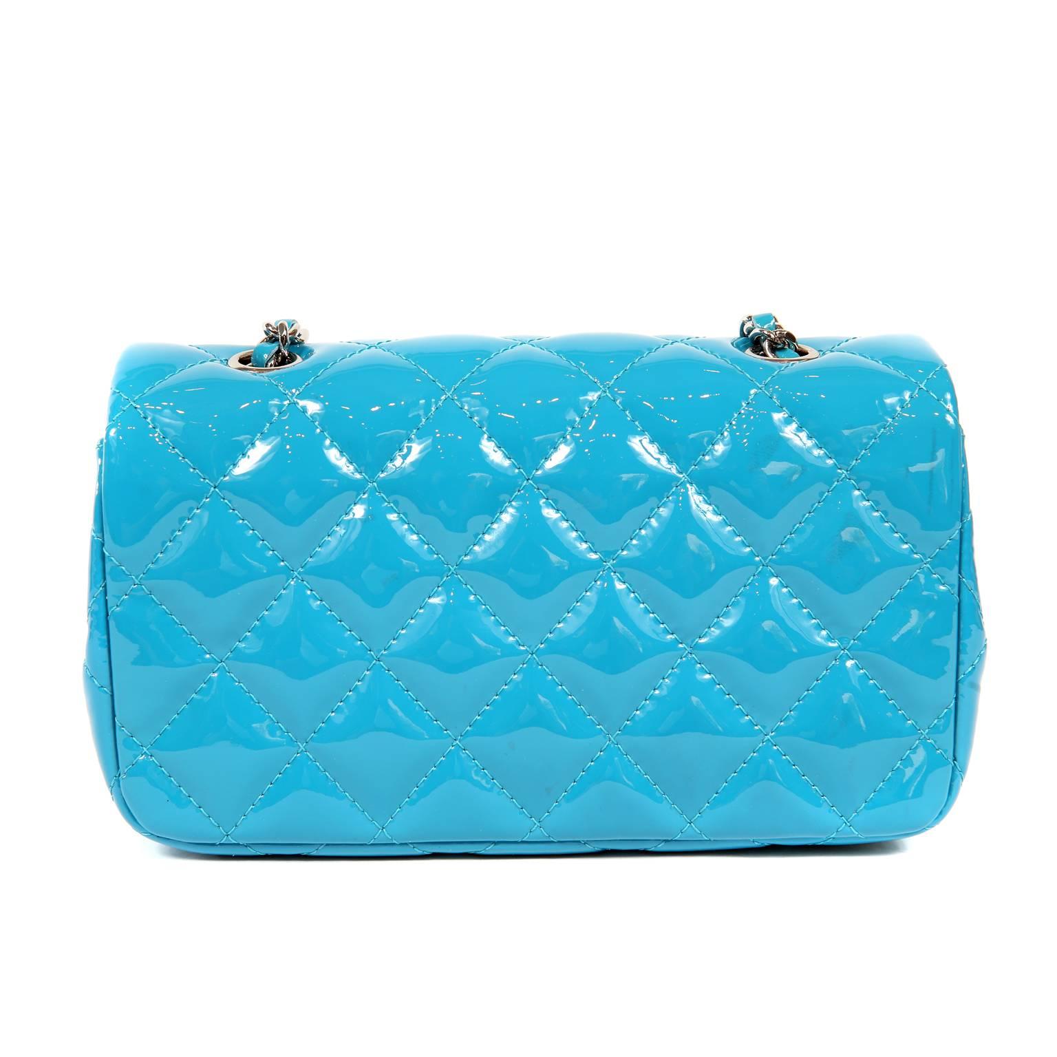 Chanel Turquoise Patent Leather Mini Classic- Excellent Condition
  In a truly stunning shade of turquoise, it’s certain to become a fast favorite in any wardrobe.
Turquoise patent leather is quilted in signature Chanel diamond stitched pattern. 