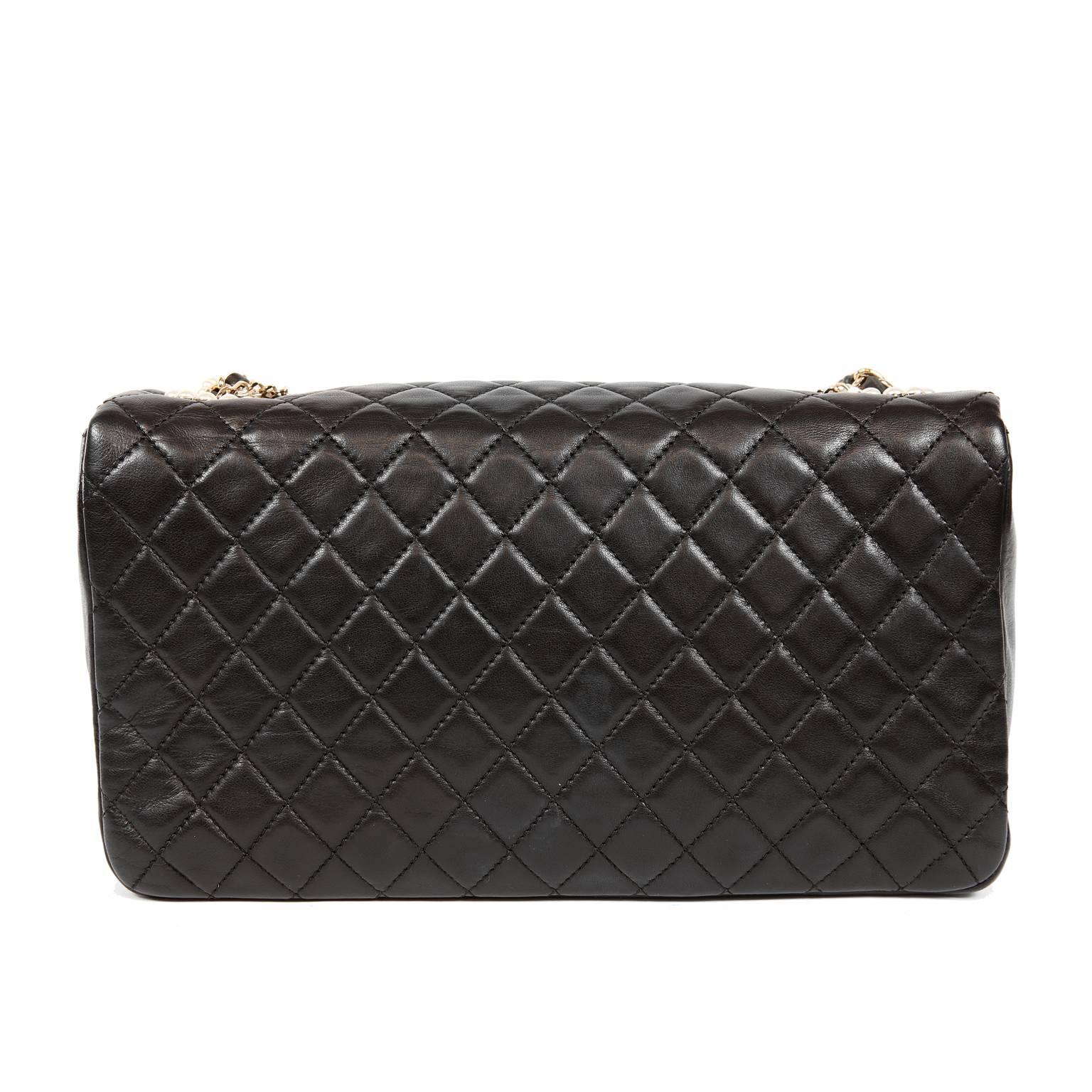 Chanel Black Lambskin Westminster Pearl Flap Bag- PRISTINE
 Collectible and beyond stunning, the Westminster Pearl Medium Flap Bag epitomizes the essence of Chanel.  Pearl and chain details enhance the Classic Flap silhouette brilliantly.  A true