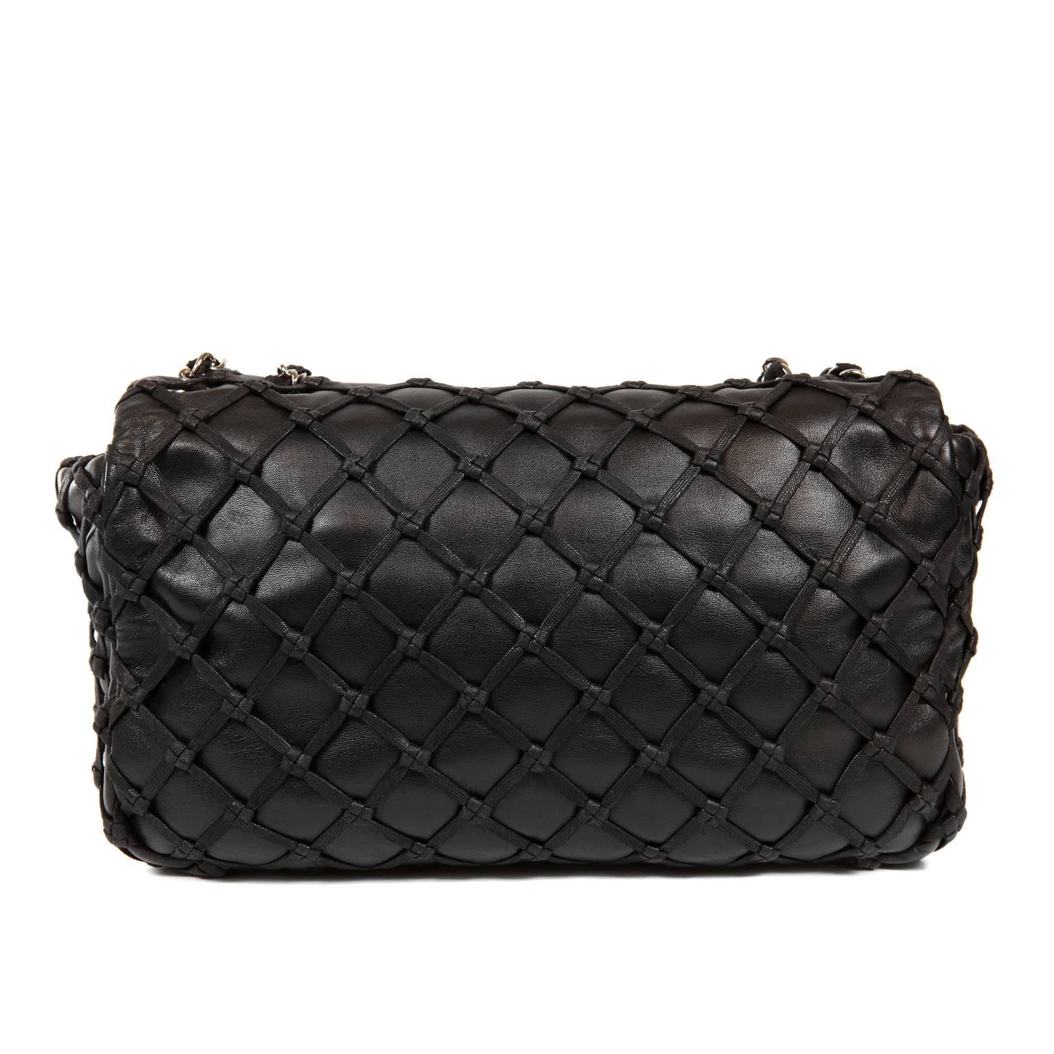 Chanel Black Leather Woven Top Stitch Classic Flap Bag- Excellent Condition
A unique take on the Classic Flap, this pretty bag features woven top stitching with subtle love knot details. Black leather with silver interlocking CC twist lock on single