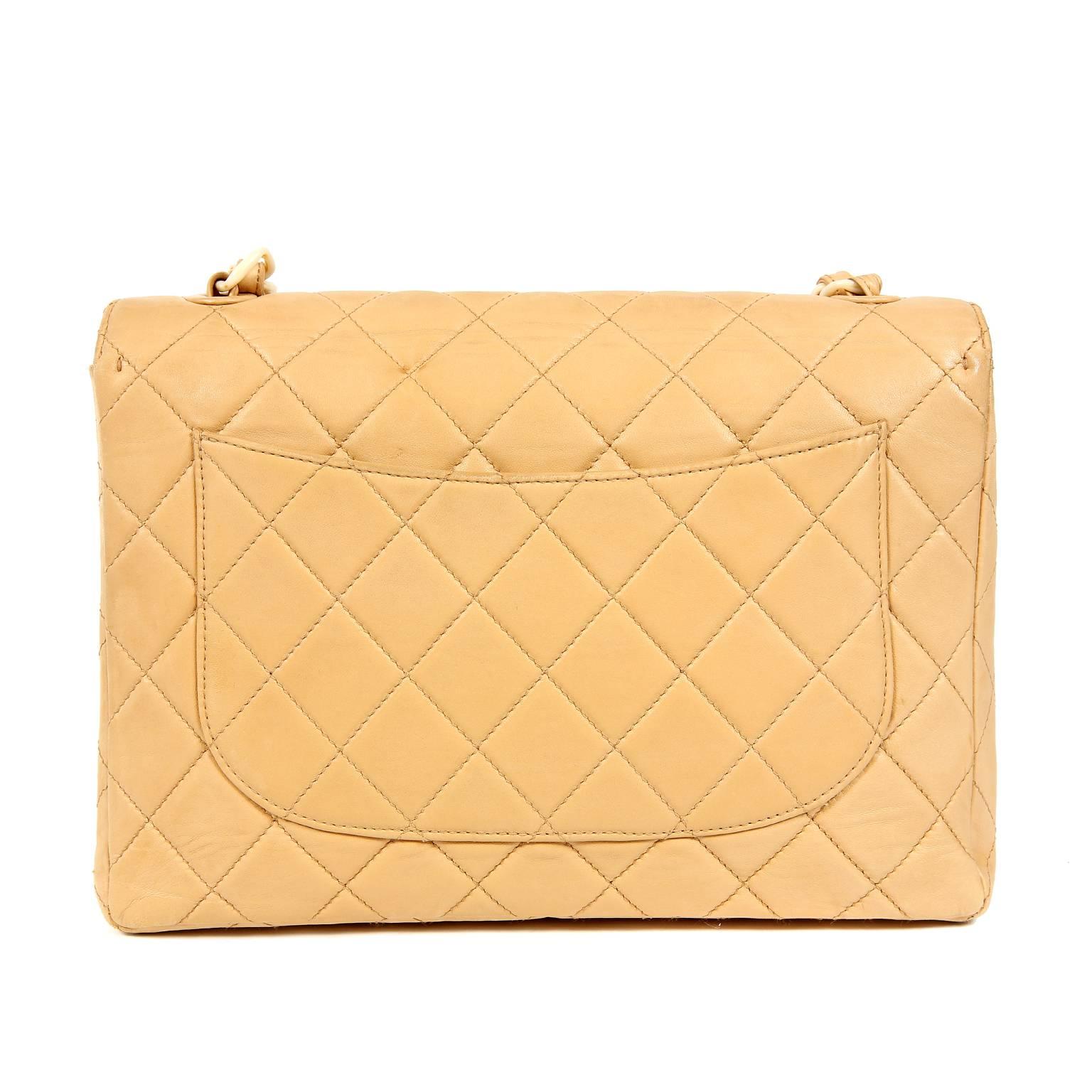 Chanel Beige Lambskin and Bakelite Vintage Classic Flap- Excellent Plus Condition
Rare and collectible, this Vintage Classic Flap is in truly beautiful condition.  Neutral beige lambskin is quilted in signature Chanel diamond pattern.  Cream
