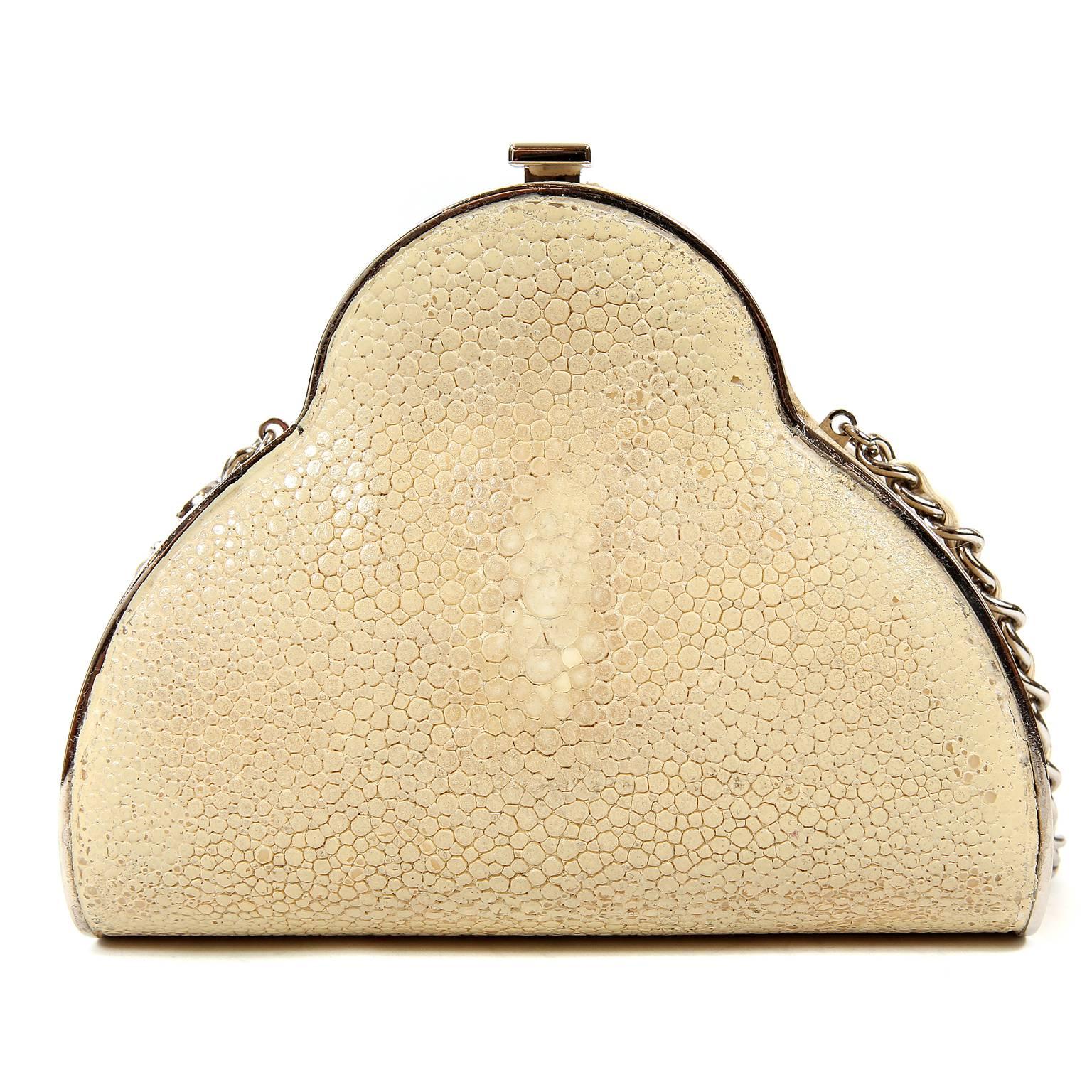 Chanel Beige Stingray Crossbody Evening Bag- Very Good Condition
 Very Rare, this is a  structured evening bag in distinctive stingray with silver hardware accents.  Hinged opening with CC push lock clasp on the top.  Cream interior.  Extra long