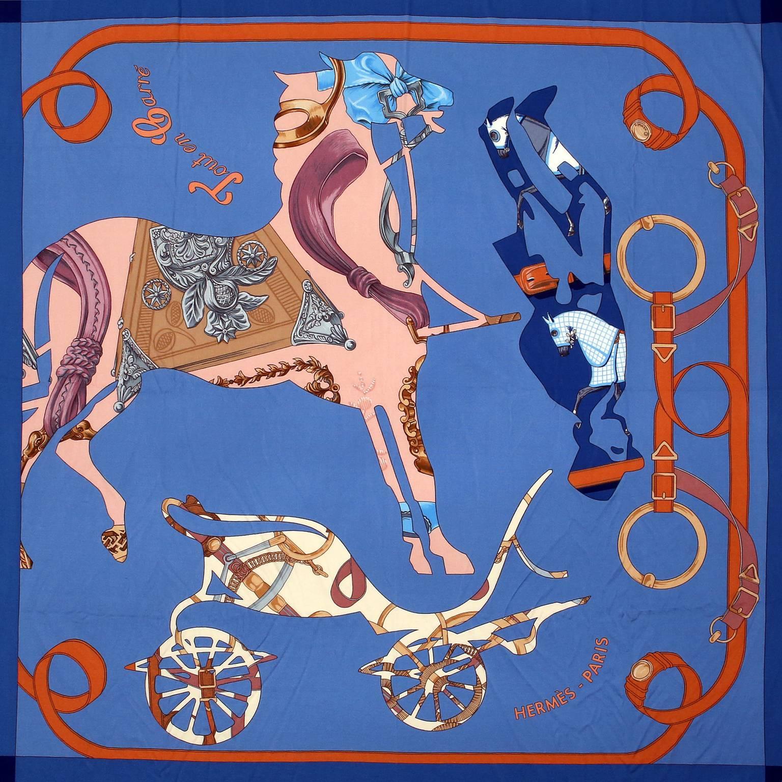 Hermès Tout en Carre Blue Elastique Silk Scarf- PRISTINE
  Designed by Bali Barret and first issued in 2006.  Reissued 2009/ 2010.
Yale blue background is a lovely shade of azure and has a darker border.  Equestrian theme featuring a horse, carriage