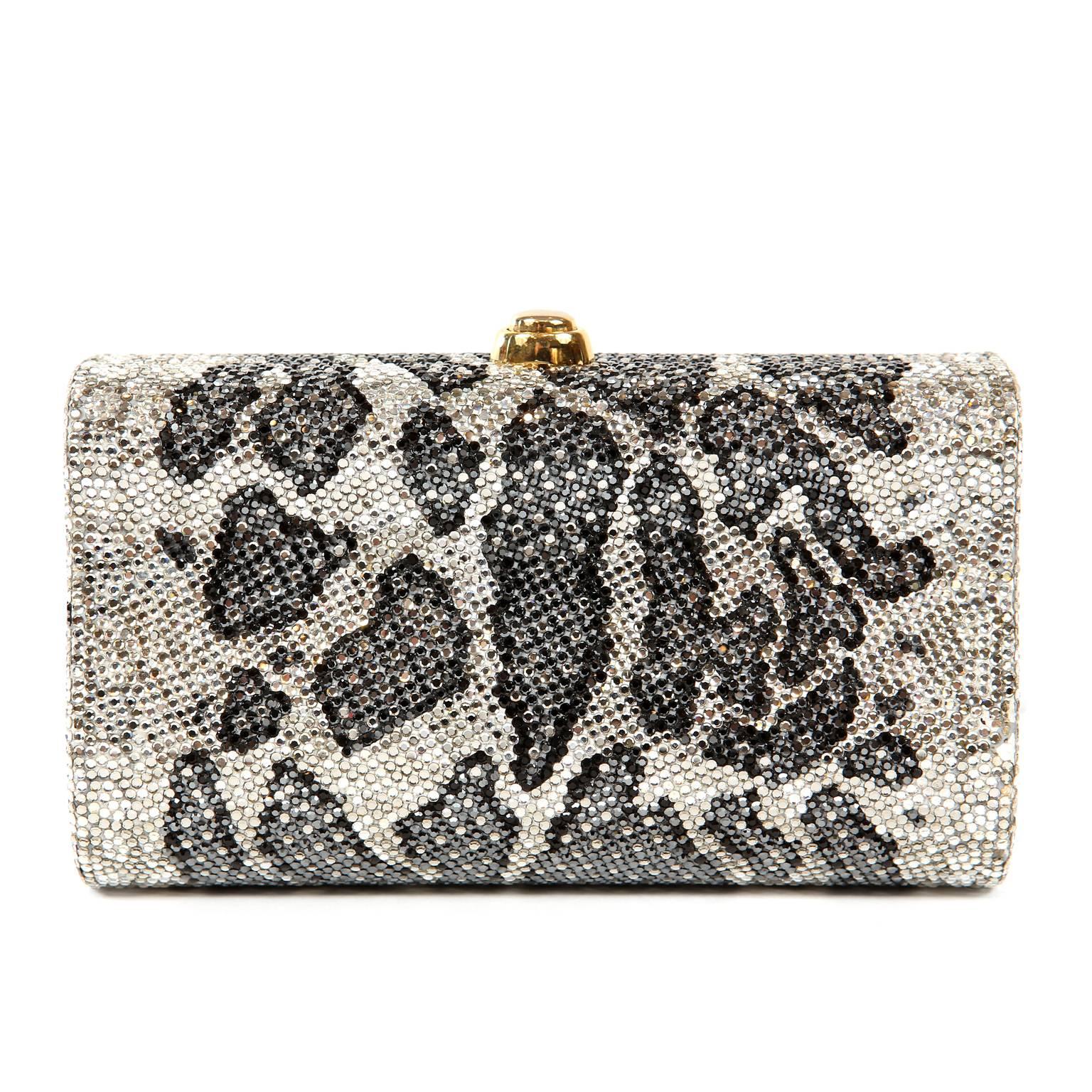 Judith Leiber Leopard Crystal Minaudiere Evening Bag- Pristine
Carried by celebrities and other fashion elites, Judith Leiber’s crystal minaudieres are legendary.  
Structured small clutch is covered in white, black and grey crystals creating a