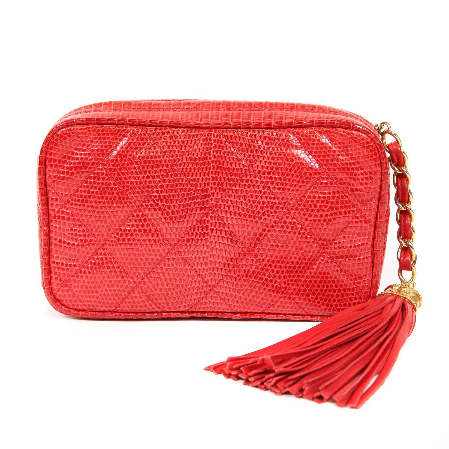 Chanel Braise Red Lizard Clutch- Excellent Condition
Collectible vintage piece from the early 1990’s in rare lizard skin.    
Bright red lizard skin is quilted in signature Chanel diamond pattern.  Zippered top has an oversized leather tassel pull