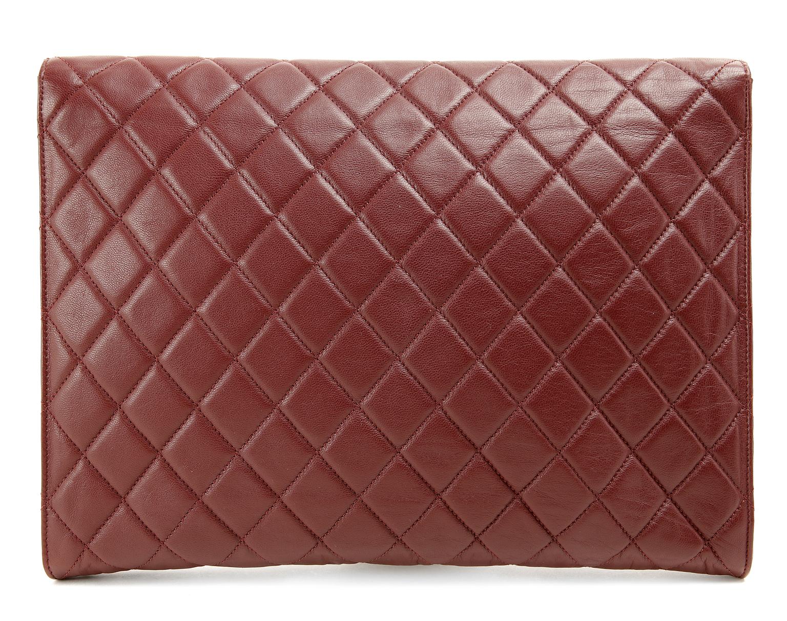 Chanel Bordeaux Leather Oversized Clutch- Pristine; appears never carried A gloriously chic document holder or a strikingly beautiful clutch, this Chanel is a versatile addition to any collection. Bordeaux wine leather oversized clutch is quilted in