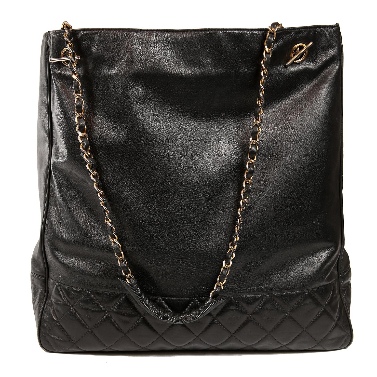 Chanel Black leather Vintage Tote- Excellent
Black leather large tote with sturdy quilted bottom portion.  Clean black leather interior has one side zippered pocket.  Snap closure.  Double leather and gold chain entwined straps are comfortably