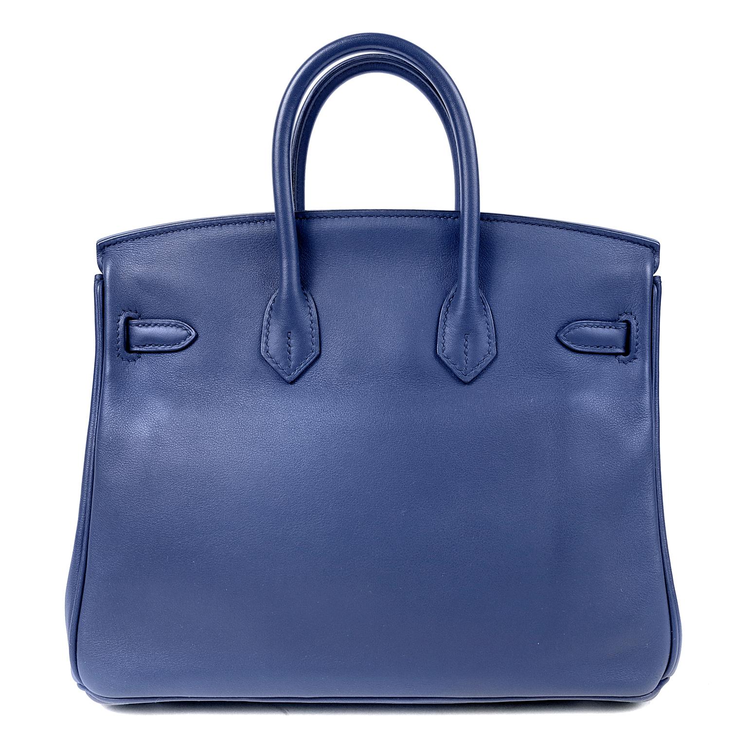 Hermès Sapphire Blue Swift Leather 25 cm Birkin Bag- Pristine Unworn Condition with plastic intact on the hardware.
Waitlists exceeding a year are commonplace for the intensely coveted classic leather Birkin bag.  Each piece is hand crafted by