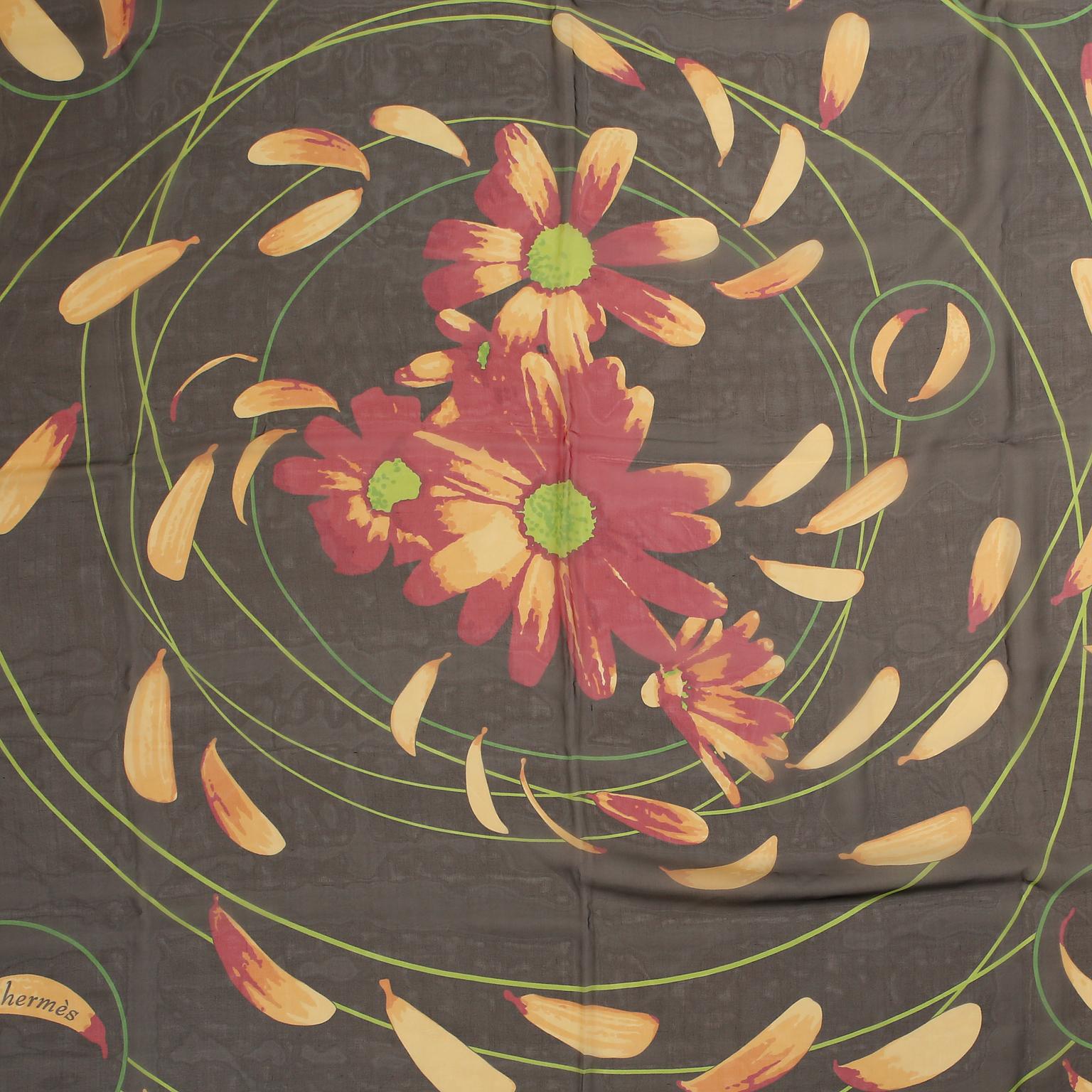 Hermès Au Gre du Vent 90 cm Silk Scarf- Pristine
 Issued in 2002 and designed by Dimitri Rybaltchenko.  Brown background with flower petals swirling “by the wind.”  100% silk.  Made in France.  35”.
A363