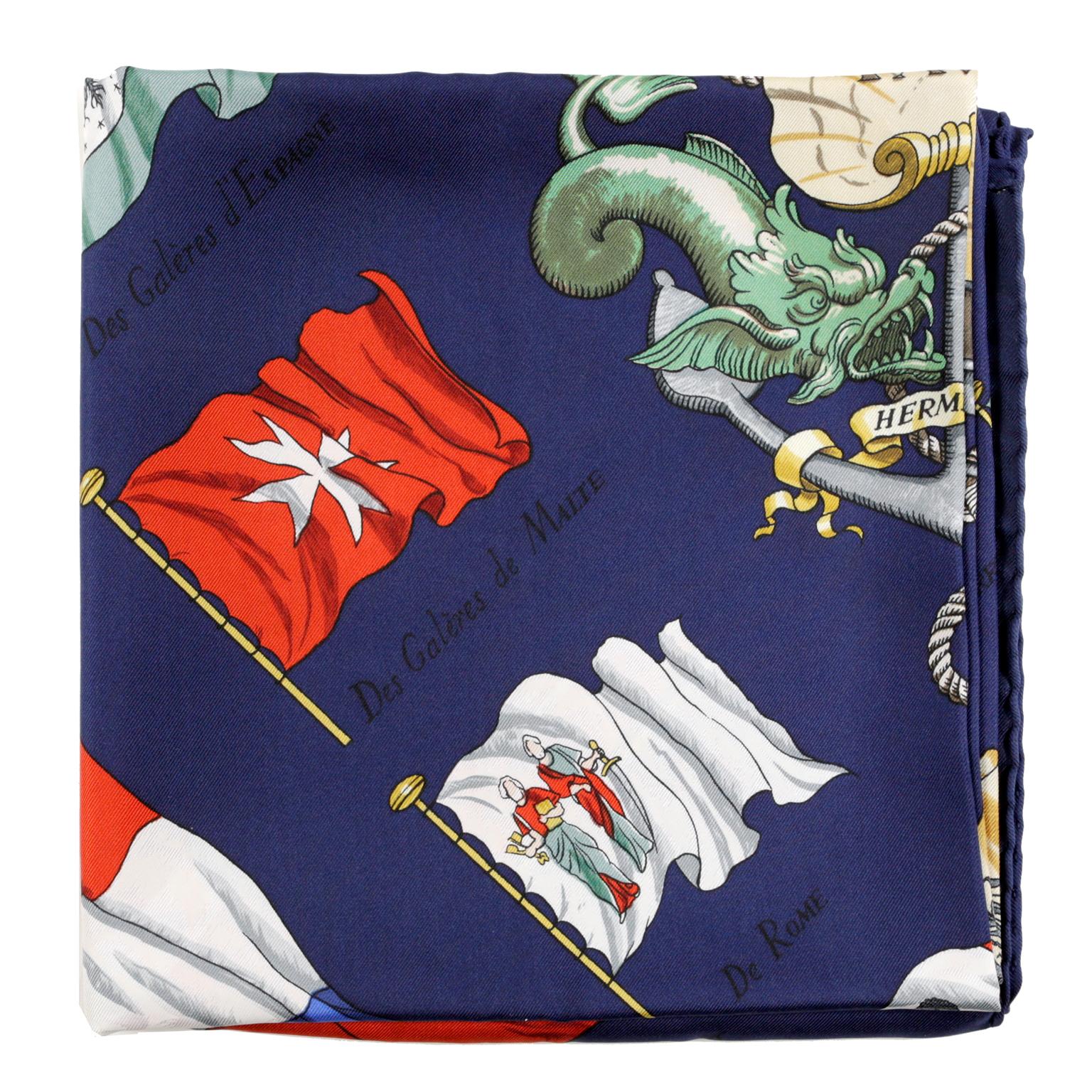 Hermès Pavois Dark Blue 90 cm Silk Scarf - Pristine Condition 
Designed by Philippe LeDoux.  Dark blue background with multicultural nautical flag pattern.  100% silk.  35” square.  
A445


