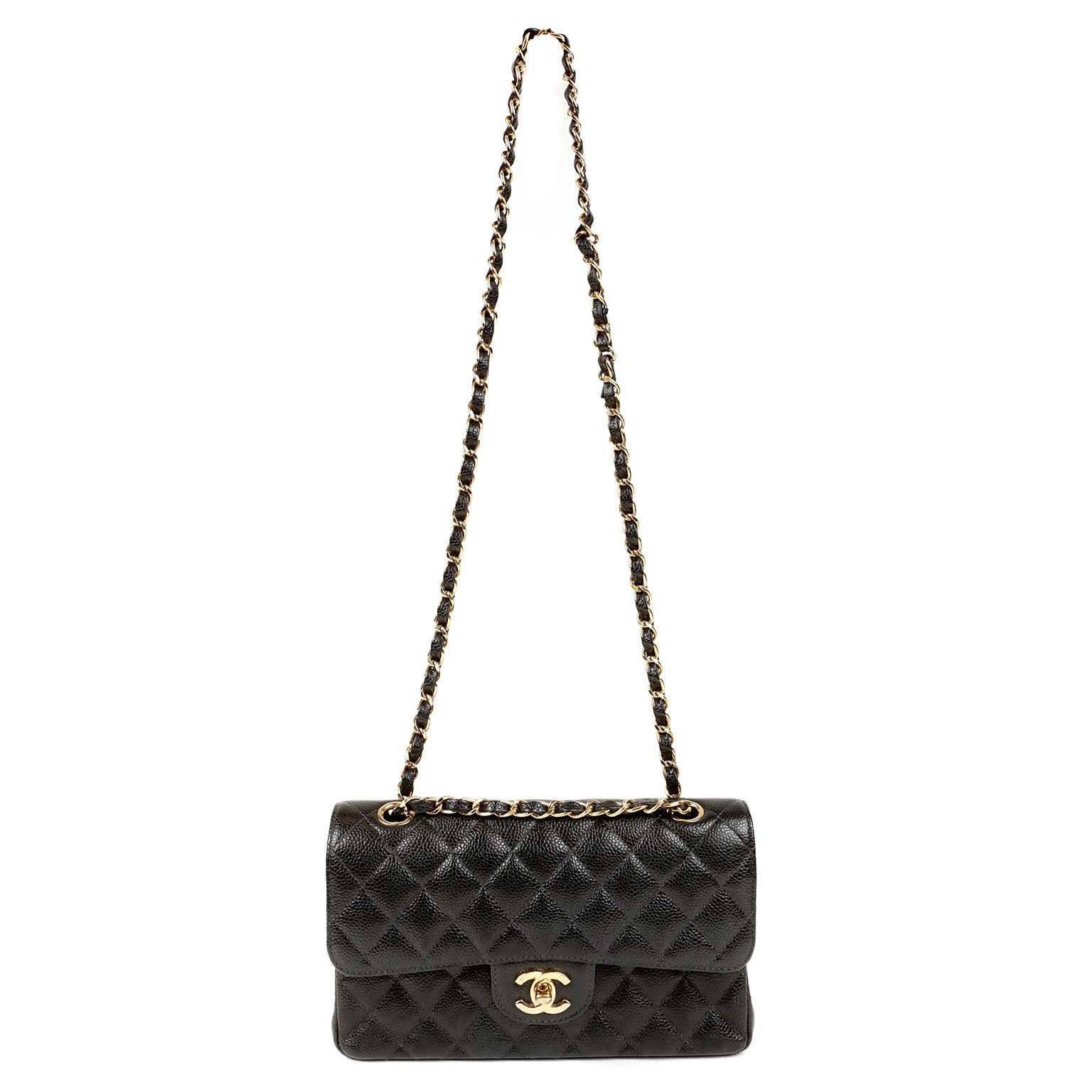 Chanel Black Caviar Classic Small Double Flap Bag- MINT
 A true must have for any sophisticated collection, the Classic in black caviar with gold hardware is intensely coveted.
Durable and textured black caviar leather is quilted in signature Chanel