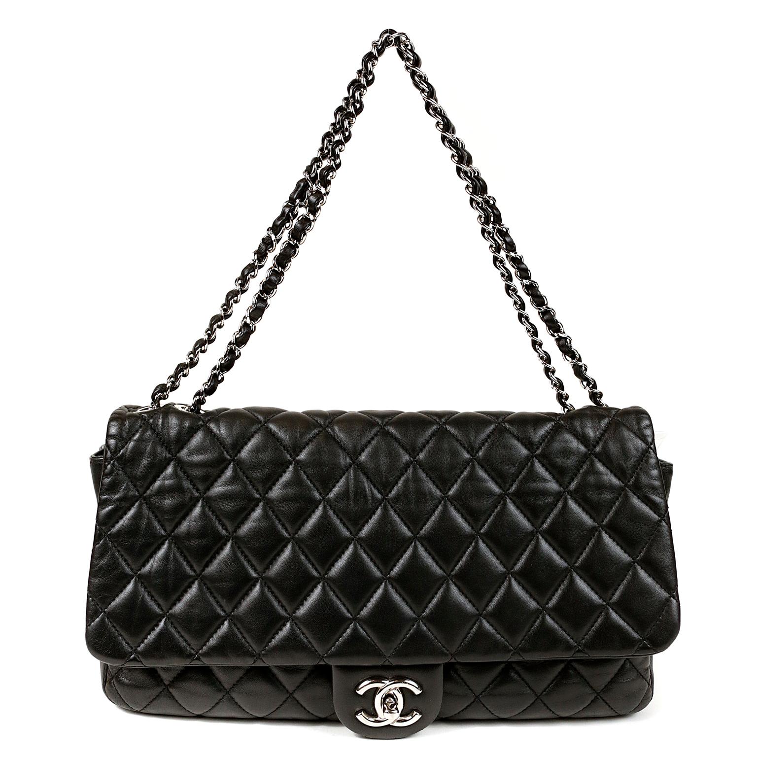 Chanel Black Leather Jumbo Coco Rain Flap Bag- MINT CONDITION
 From the Paris Shanghai Collection, this ingenious classic flap has an attached rain coat concealed in the rear pocket.  
Black leather is quilted in signature Chanel diamond pattern. 