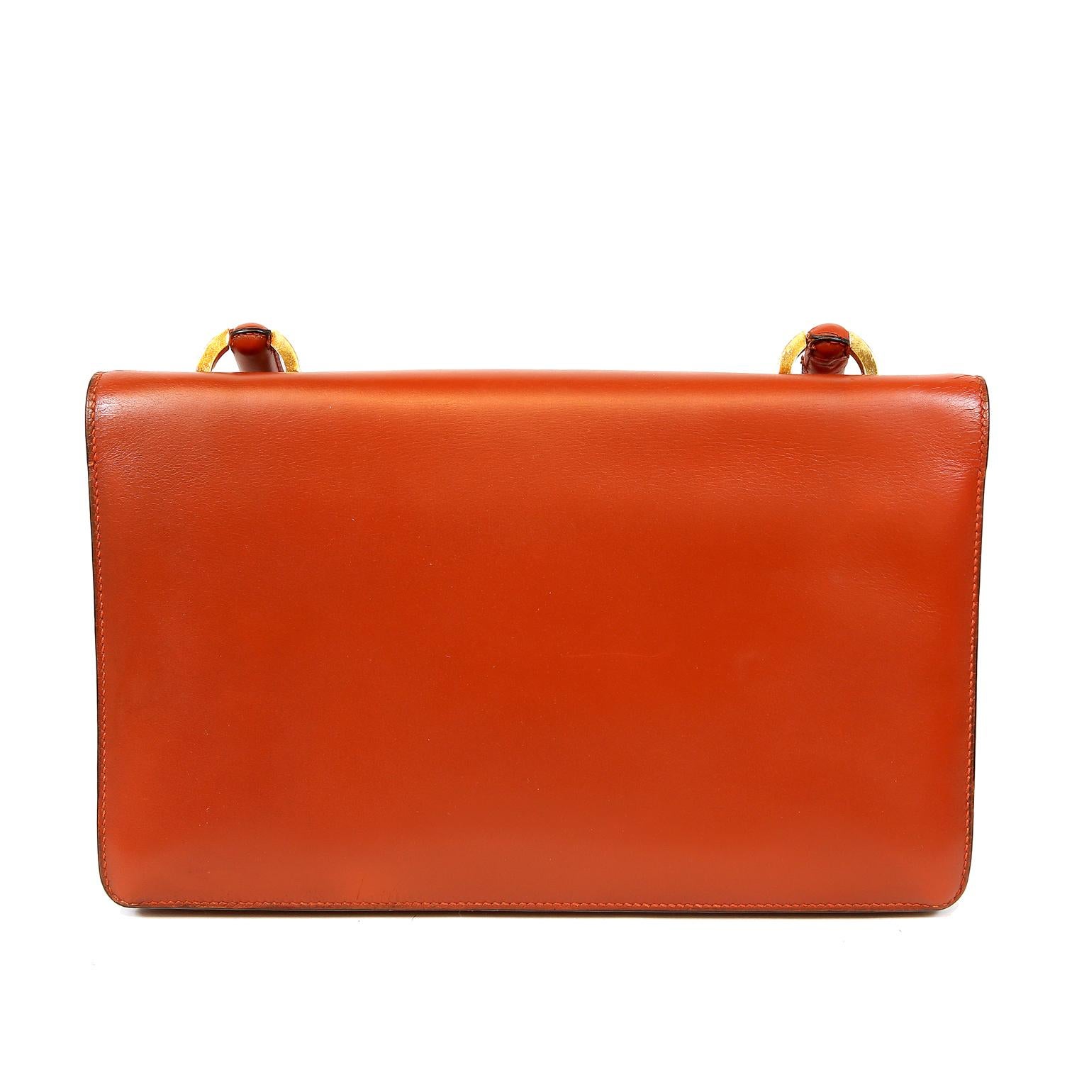 Hermès Brick Box Calf Vintage Handbag- Excellent condition.
Classic and feminine, it is an exceptional find for collectors.
Brick red smooth calf leather slim satchel with gold hardware accents.  Gold circle clasp and rounded top handle.   Leather