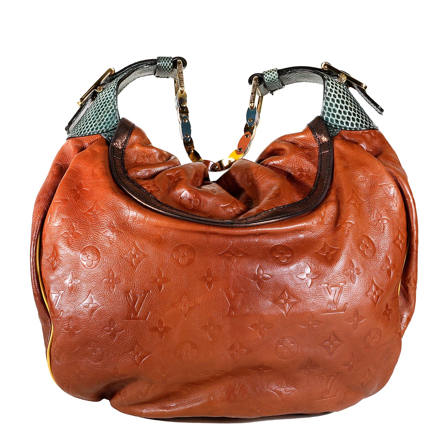Louis Vuitton Paprika Monogram Leather Kalahari GM - NEW condition
 From the Spring Summer 2009 Collection, this special edition of the Kalahari has some amazing design elements.  
Rich Paprika calfskin is subtly imprinted with signature Louis