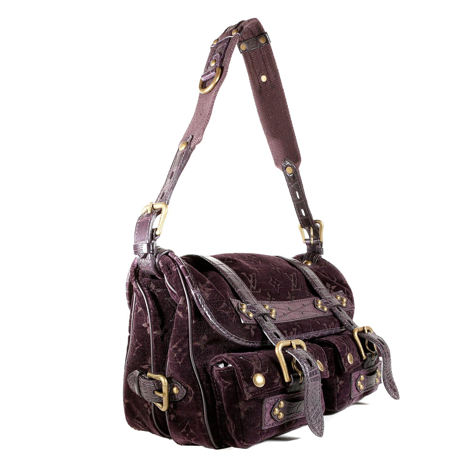 Louis Vuitton Eggplant Monogram Velours Clyde Bag- Pristine and Unworn
From the 2004 Collection, it combines plush fabric with exotic accents.  
Eggplant purple velour is subtly imprinted with signature Louis Vuitton monogram.  Alligator belts and
