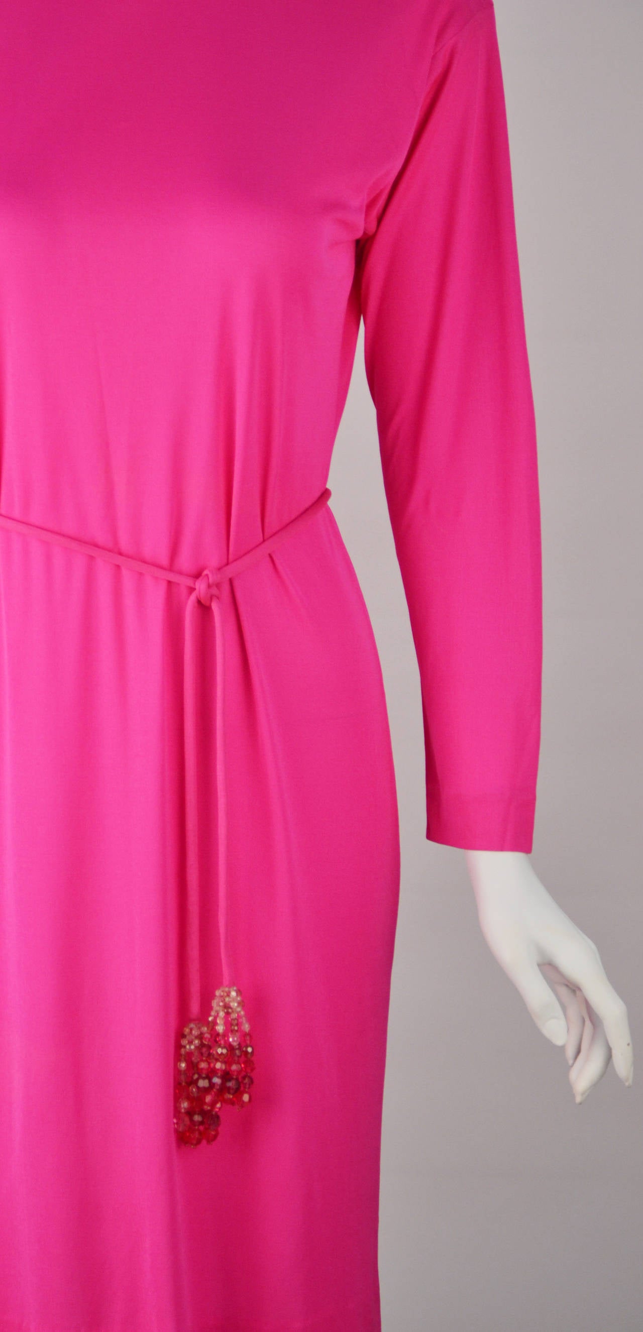 Simply chic, hot pink Pucci silk knit dress. It can be worn any season, any time of day. Throw a blazer over it for work or a pair of high heels to go out at night!. The belt, with its Coppola e Toppo crystal beaded tassels, looks great as a