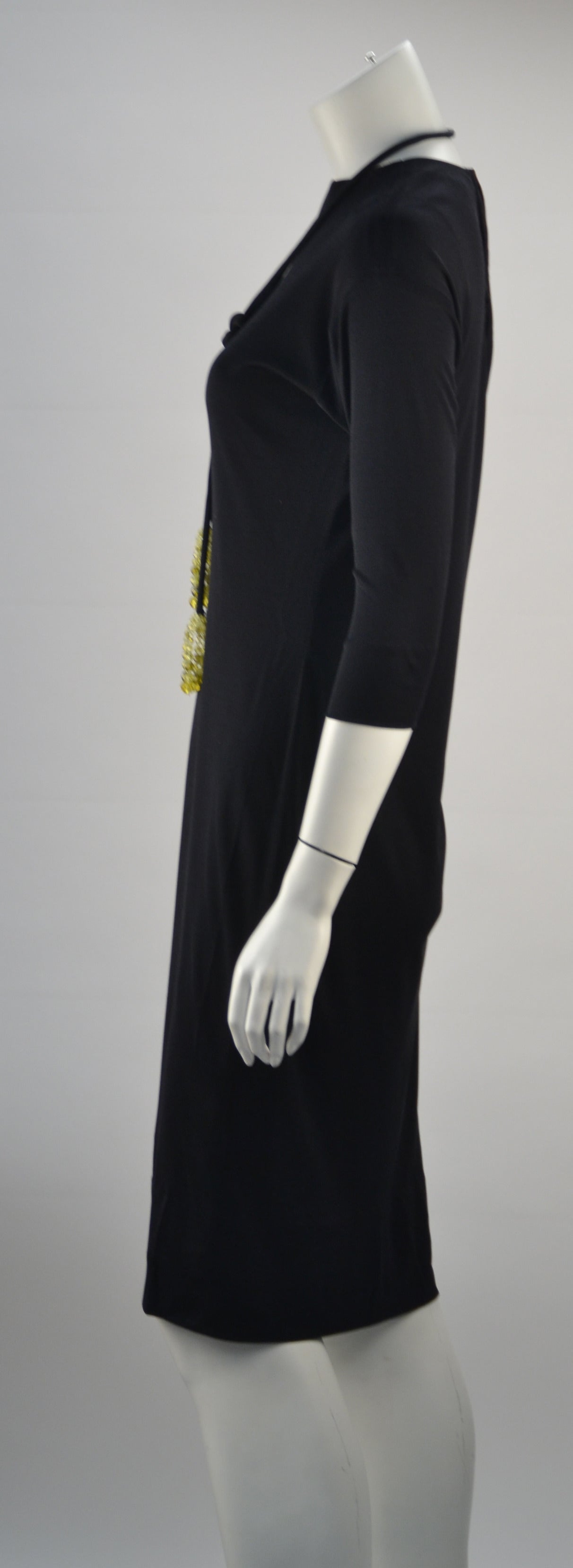 Simply Chic, Black Pucci silk knit dress (One of three). It can be worn any season, any time of day. Throw a blazer over it for work or a pair of high heels to go out at night!. The belt, with its Coppola e Toppo crystal beaded tassels, looks great