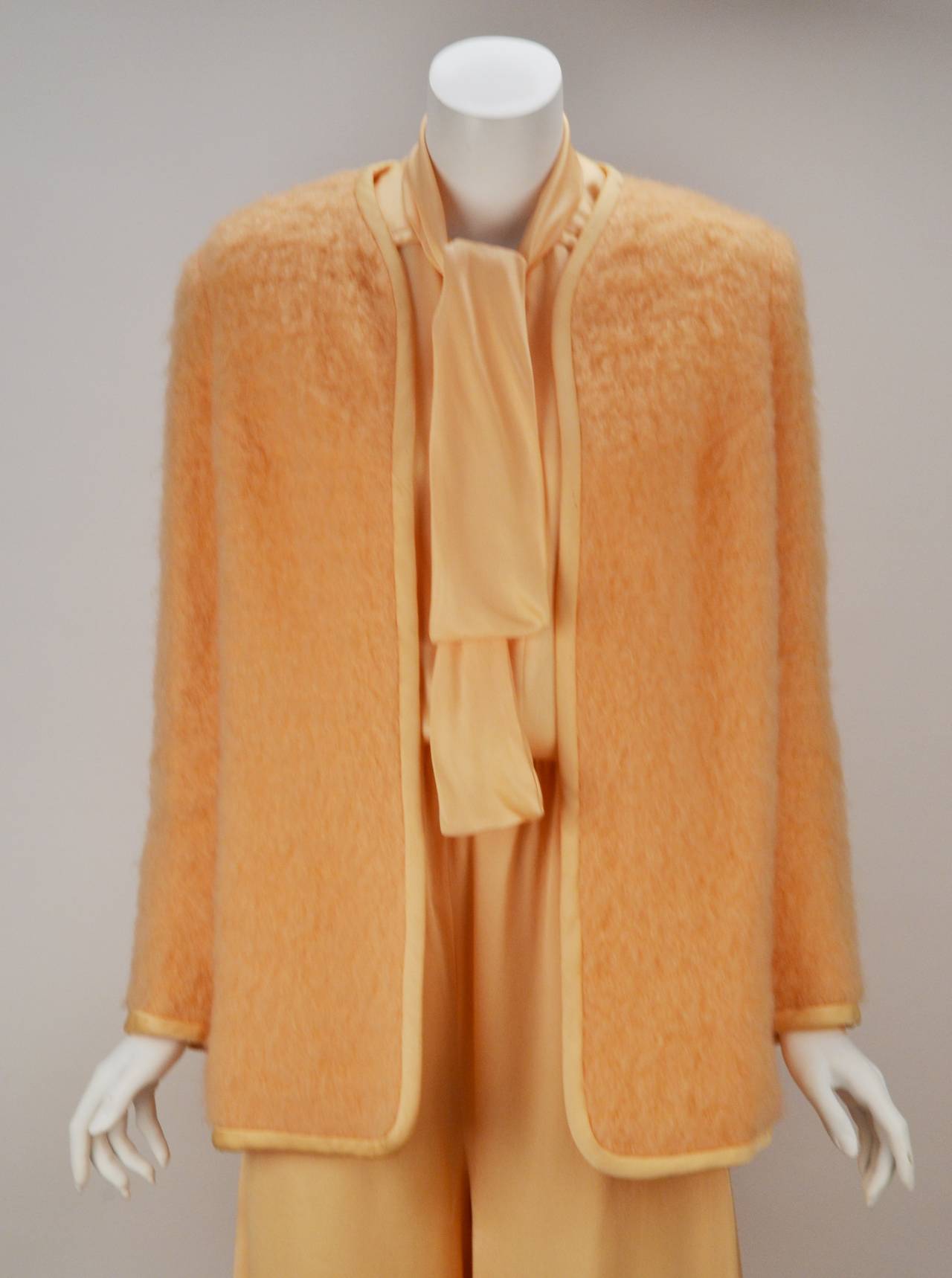 70s Bill Tice peach ensemble. Gaucho pants and button front blouse with tie create an easy flowing style. Add the peach brushed wool jacket for cool weather. Jacket is bound around neckline and sleeves. Boots, heels or flats can be worn with this