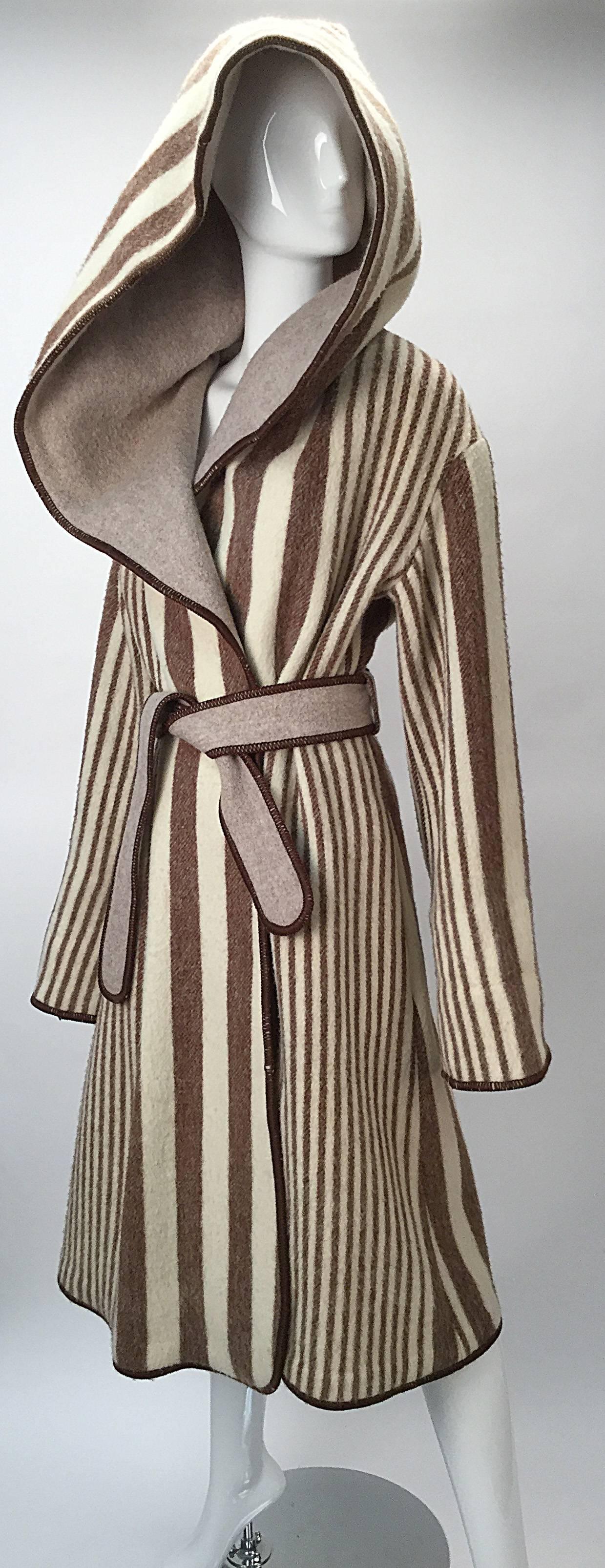 Awesome hooded wrap coat by Vintage Casa De Lama!  Cream and Brown Striped Wrap Coat with deep hood exudes warmth and absolute comfort.

Tan Lapels and belt have brown stitching. 

Super cozy, like a blanket!

Modern size 4/6

Bust: 54
