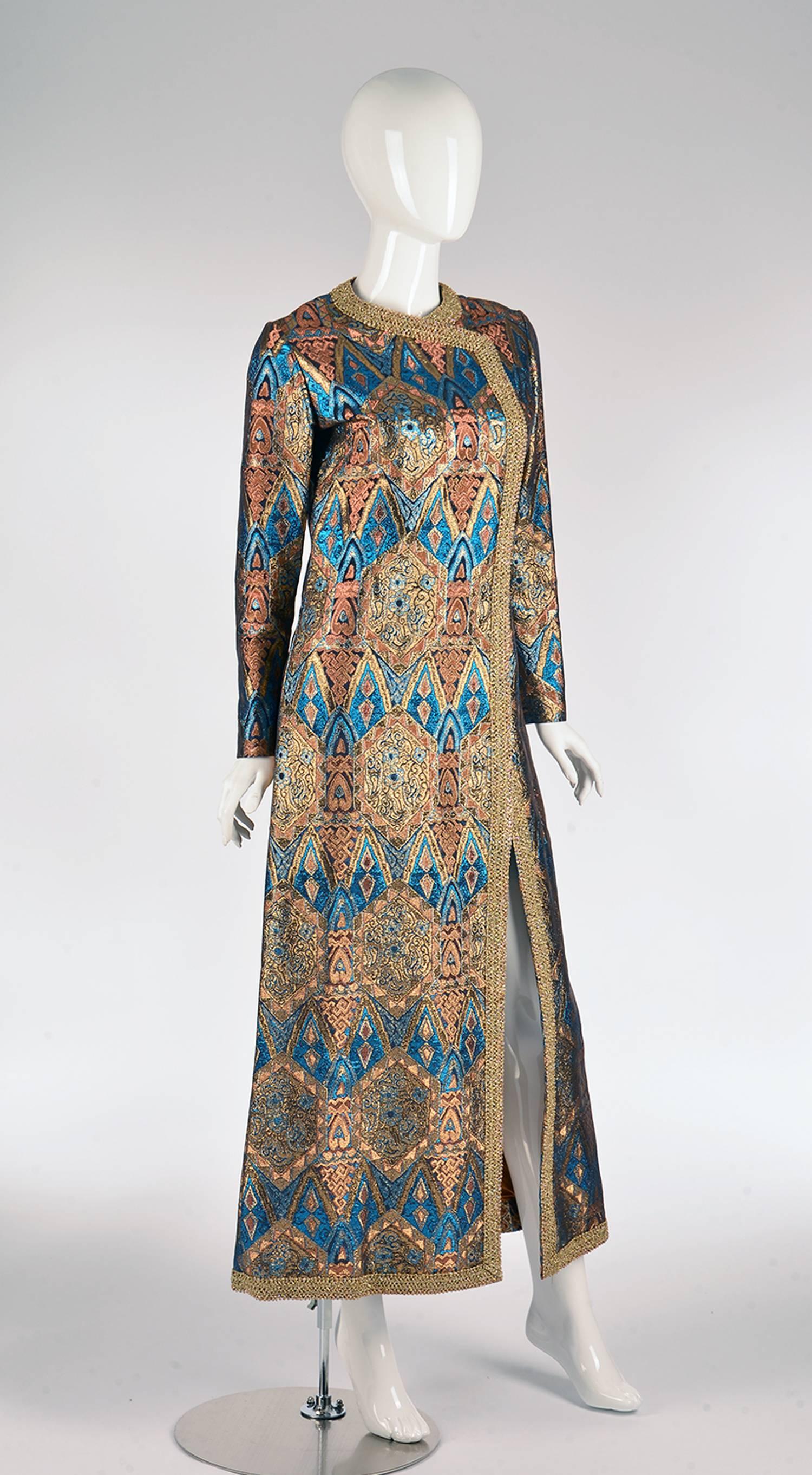 Fantastic 1960s metallic caftan in gold, blue, and copper attributed to Trigere.   

During the turn of the 20th century western designers looked east for exotic inspiration, included in the group was Pauline Trigere especially in love with the