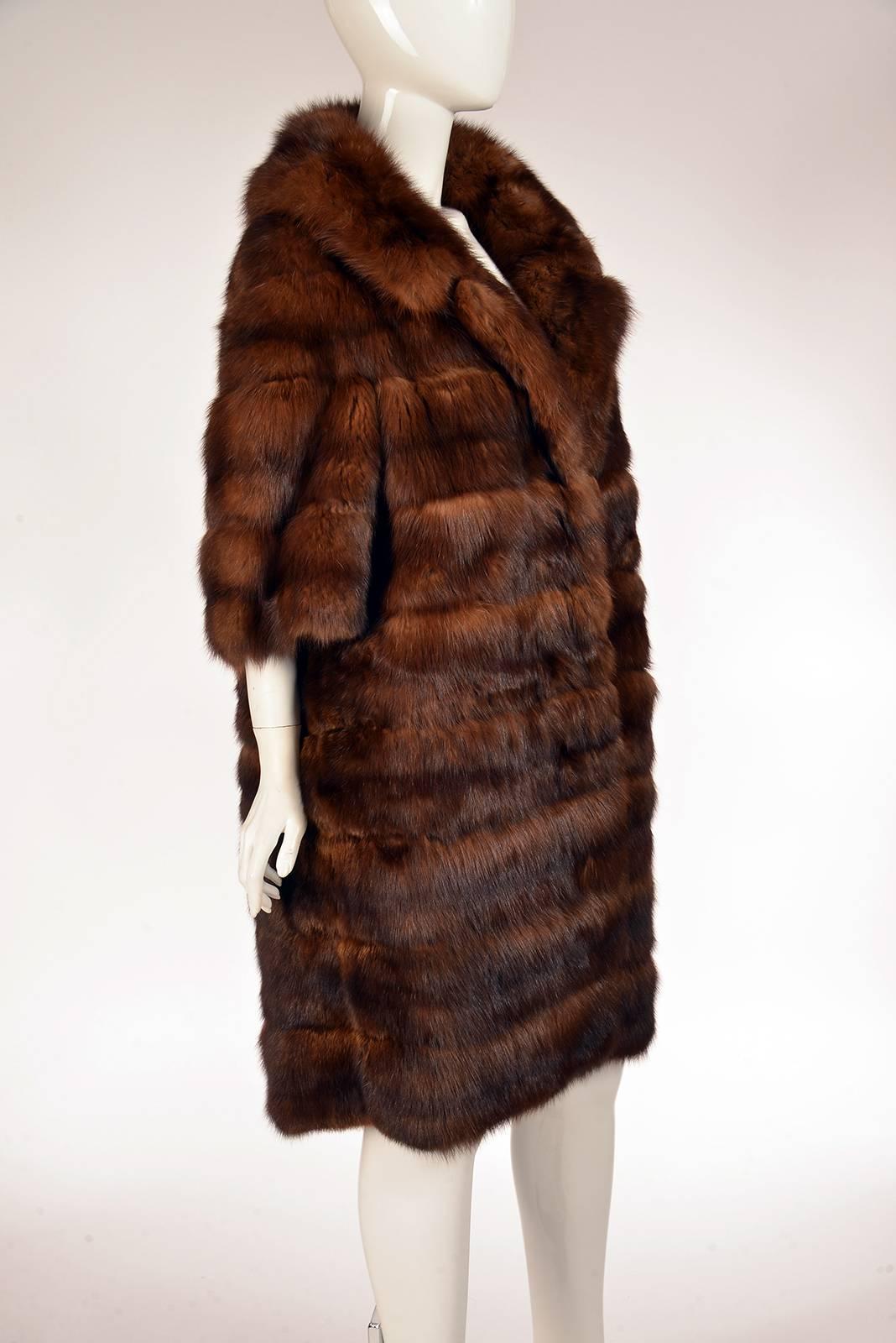 Unbelievable 1950s timeless Maximilian rich mink coat. Femininity is expressed in the details of the design with three quarter sleeves, knee length and it's large collar. Thoughtful design with horizontal stripes and cut creating a lovely
