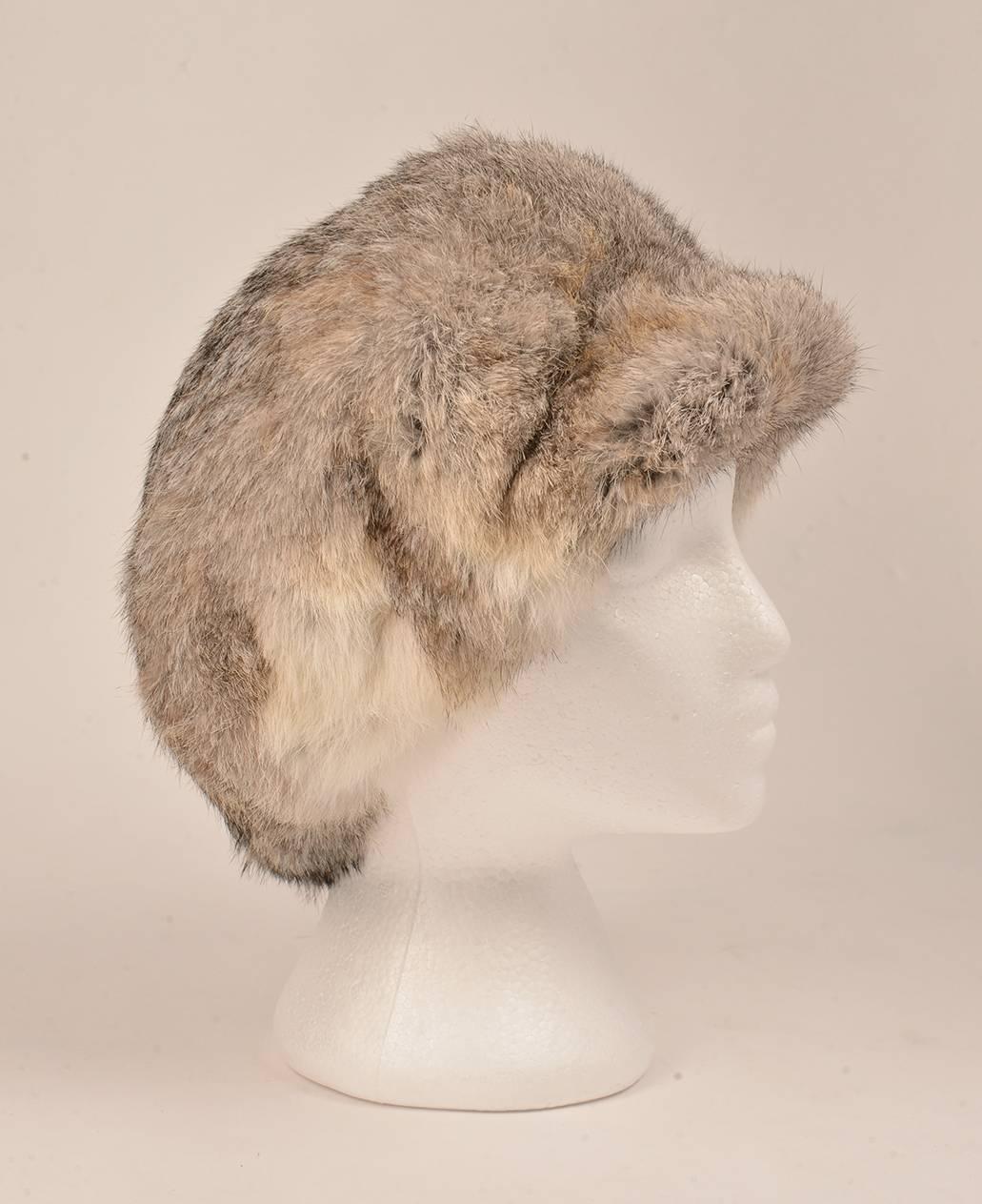 Vintage 1960s Adolfo II hat. This plush hat is made of rabbit fur, and features a bill to protect the wearer's eyes from the sun. The gorgeous, sumptuous fur is extremely soft, and is long enough to keep the head and ears warm. The fur exhibits a
