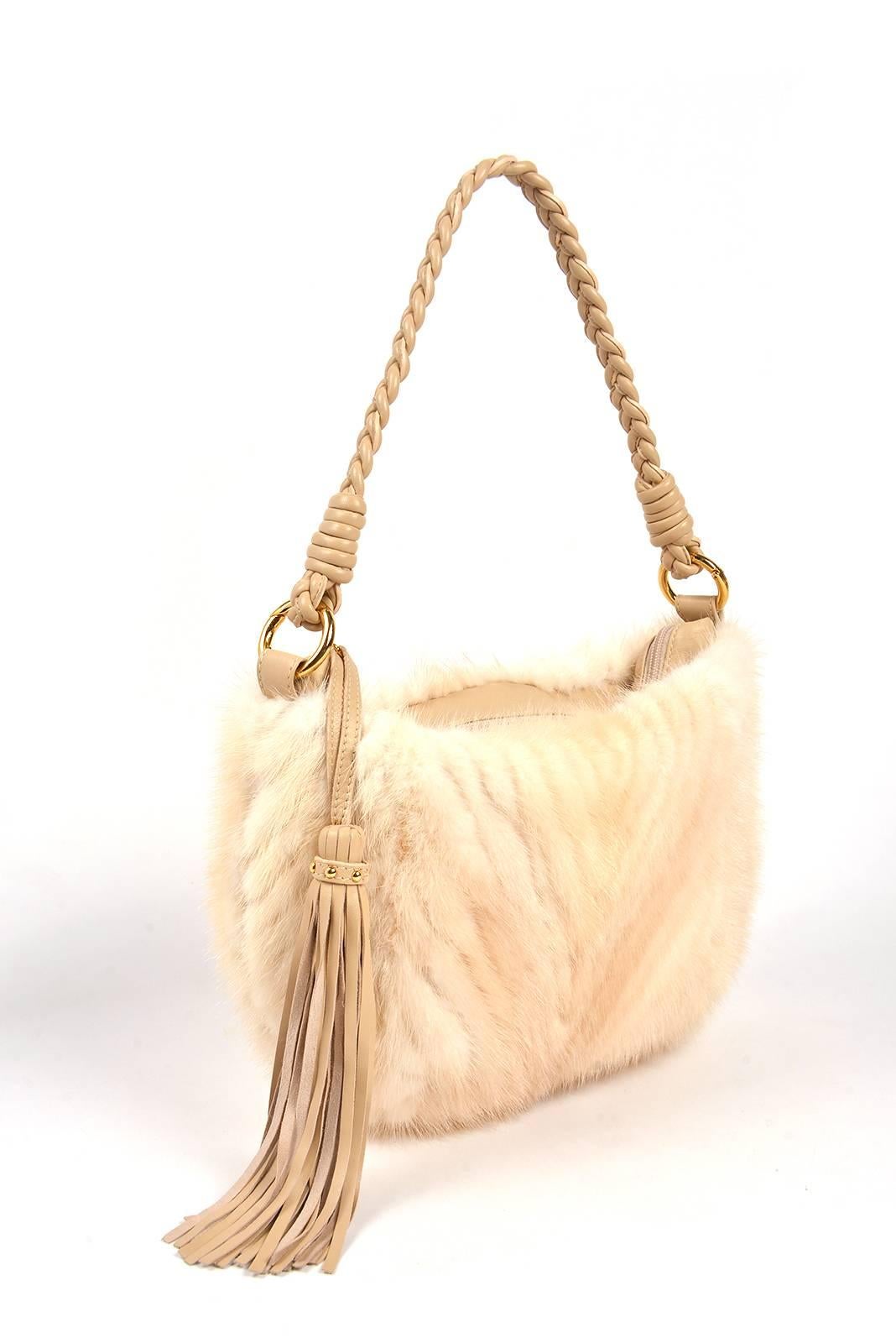 Paolo Masi White Mink and Leather Hobo Style Bag. Classy and fun for any fashionista! This white mink and tan leather hobo bag is fantastic. With a braided leather handle and long tassel. The tassel has six gold round balls on the tassel handle.