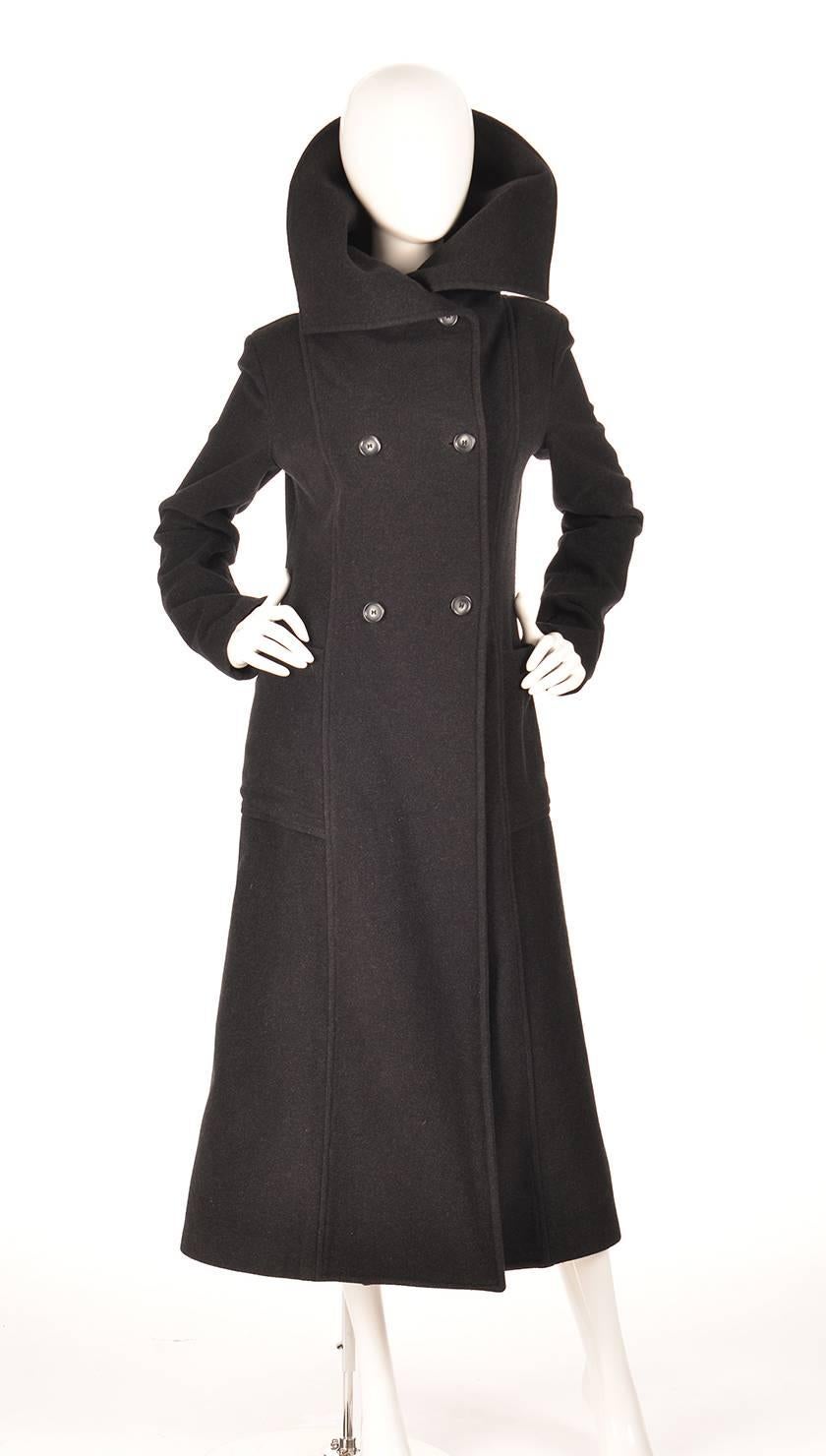 Vintage Ivan Grundahal Double Breasted Princess Seam Coat

Dramatic black double breasted princess seam coat by Ivan Grundahal. The coat features a fold-able, large stand collar to help keep you warm and fabulous on those cold, windy days. Two