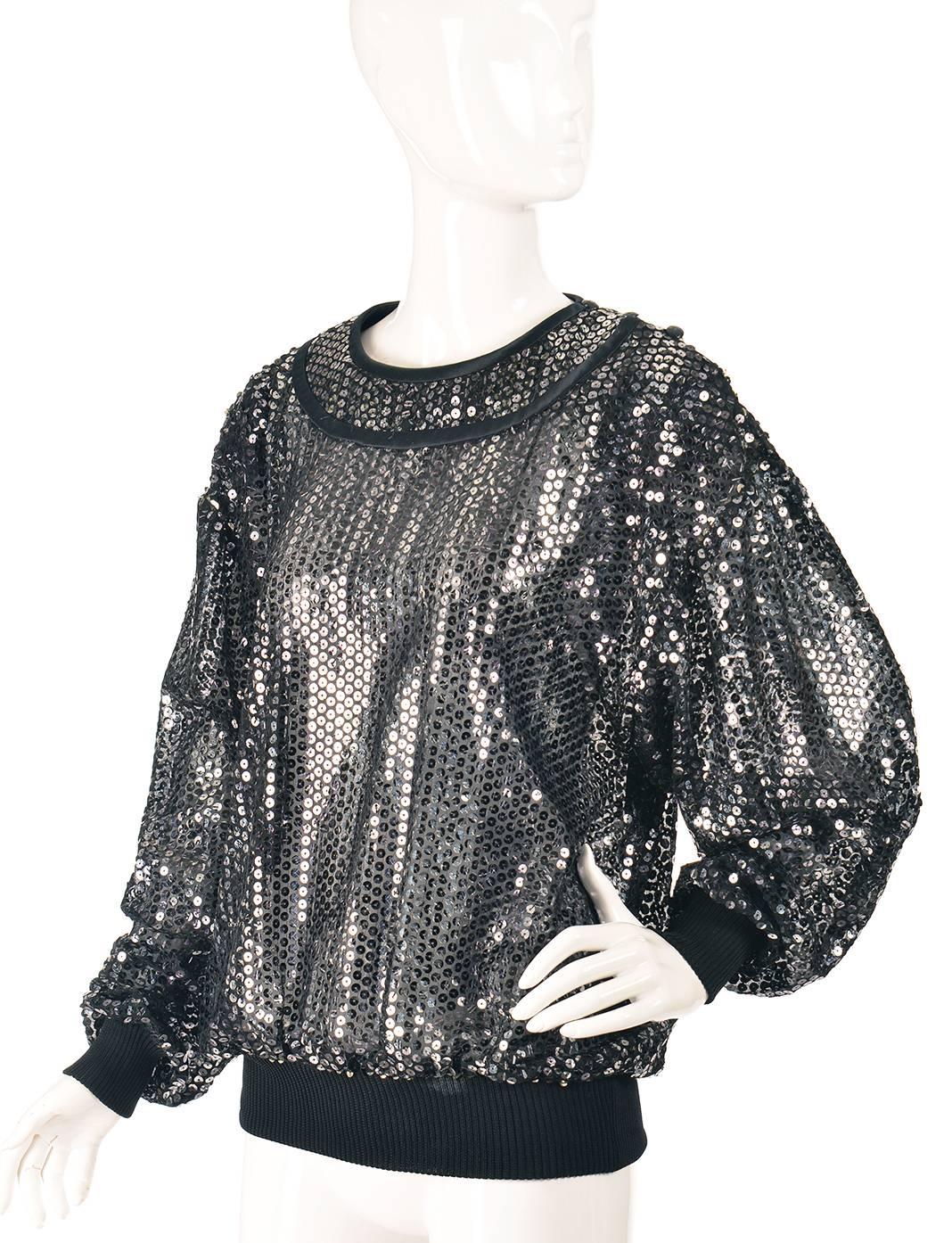 1980s Ungaro Variegated Sequin Top. 

This 1980s Ungaro sequin top is luxurious and relaxed! The blouse features vertical variegated black to silver to black sequins in a polished and elegant grunge style. The sequins are affixed to a black, sheer
