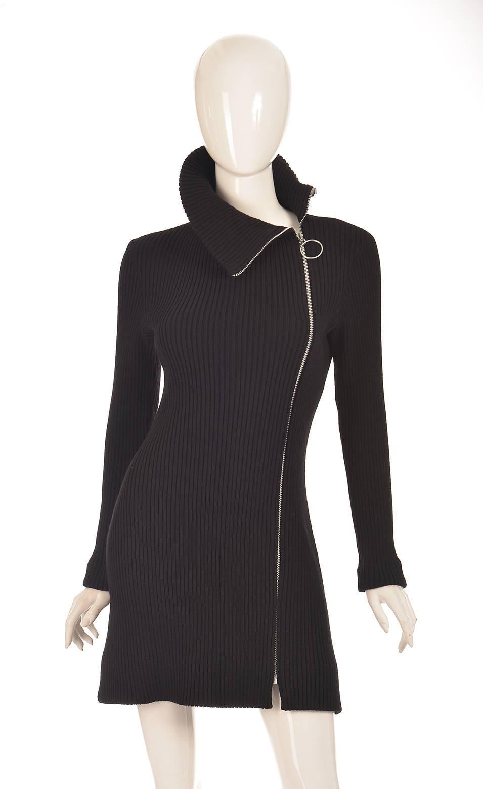 
This iconic, rib knit dress by Rudy Gernreich for Harmon Knitwear is 100% wool, and features a Talon zipper that runs the full length of the dress. The zipper is located left-of-center and can be zipped up to the top of the neck or left completely
