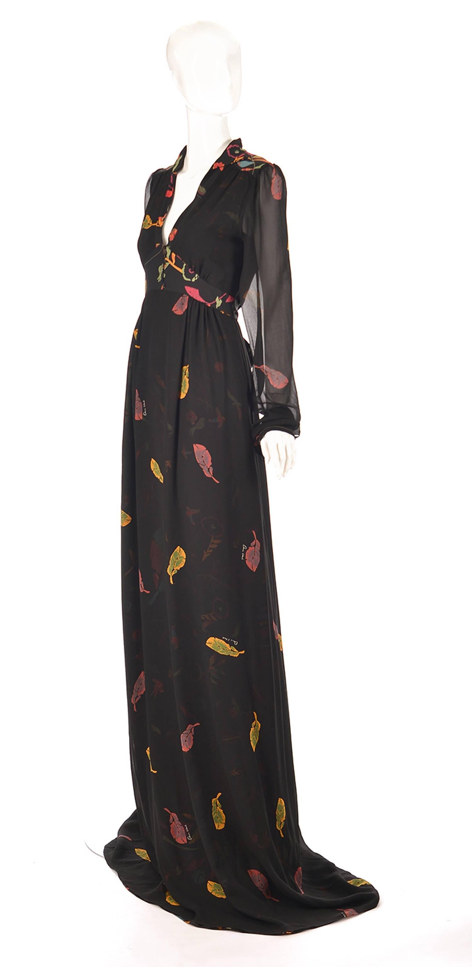 During its brief 1 year comeback comes this 2008 NWT fantastic unworn Ossie Clark revival gown with Celia Birdwell print.

This romantic extreme length black silk dress features delicate feather and floral prints in beautiful fall/autumn gem tones.