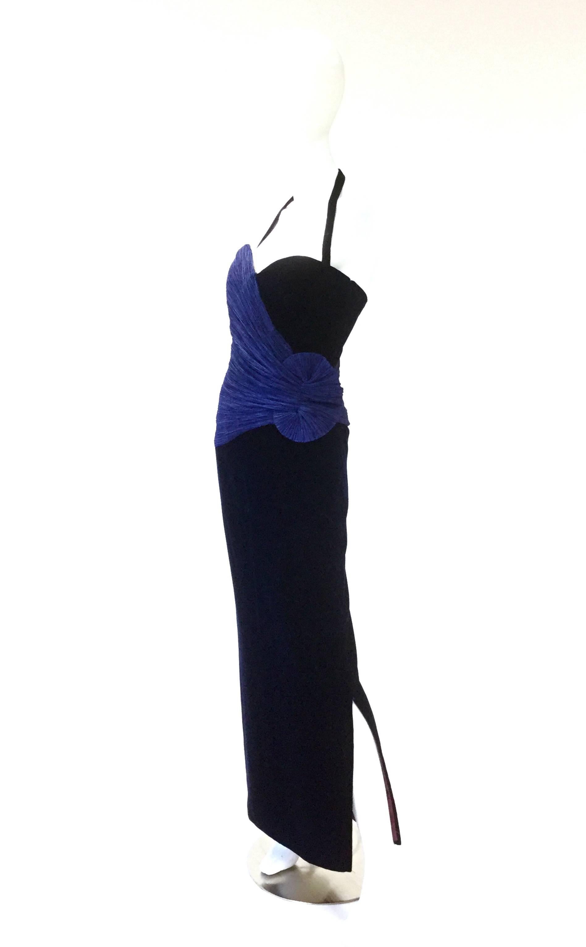 This fitted indigo taffeta and black velvet dress has a sweetheart neckline with optional halter top straps, and is ankle length. The velvet dress has more than a passing similarity to another of Murray Arbeid's designs - the 1987 red and black