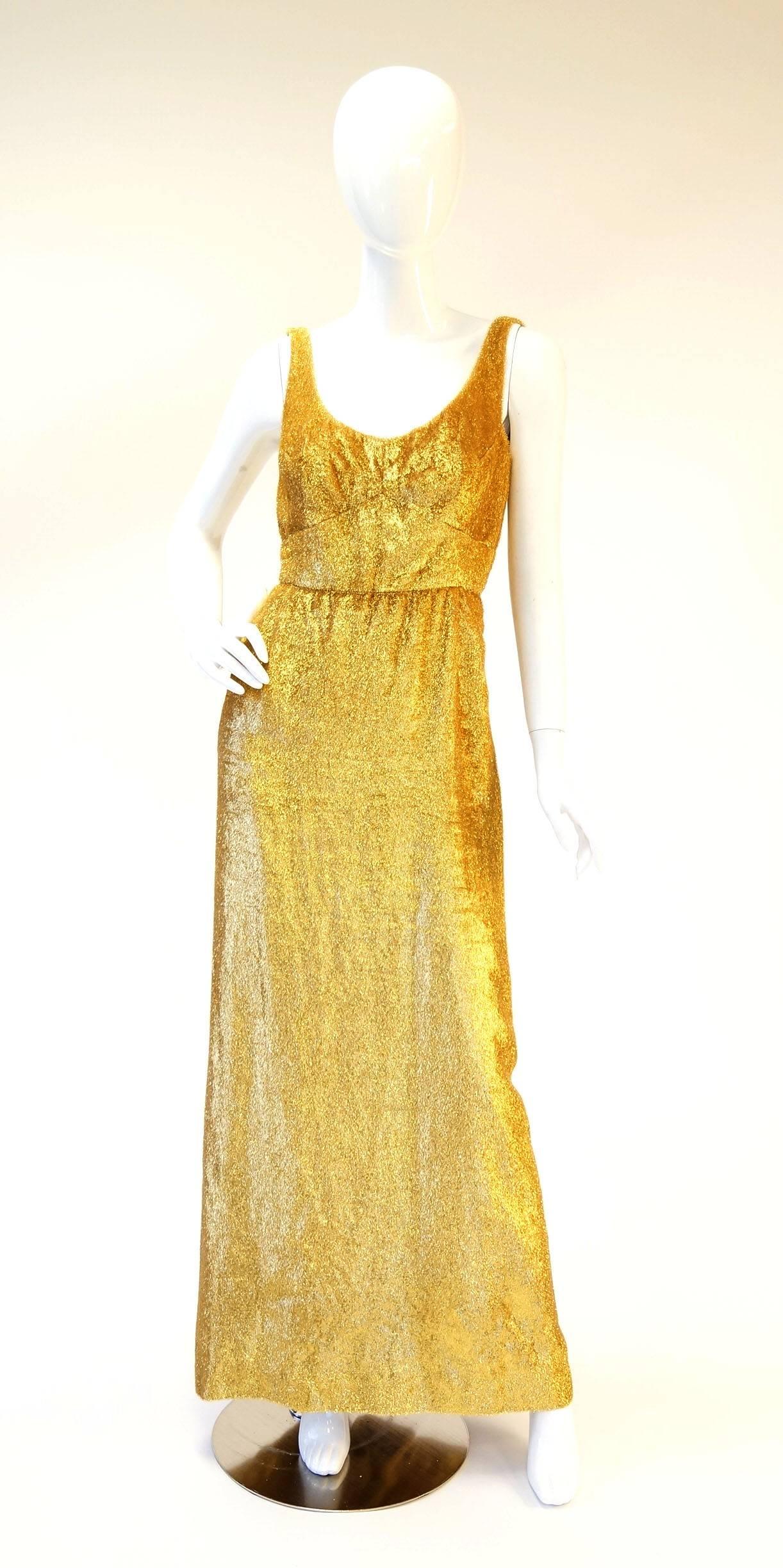 Vintage Norman Hartnell Gold Lamé and Mink Evening Dress and Matching Coat

Stunning Norman Hartnell gold lamé evening dress and matching coat. The shimmering A-line dress features a low scoop neck, a geometric stitched bodice, a low back, and a