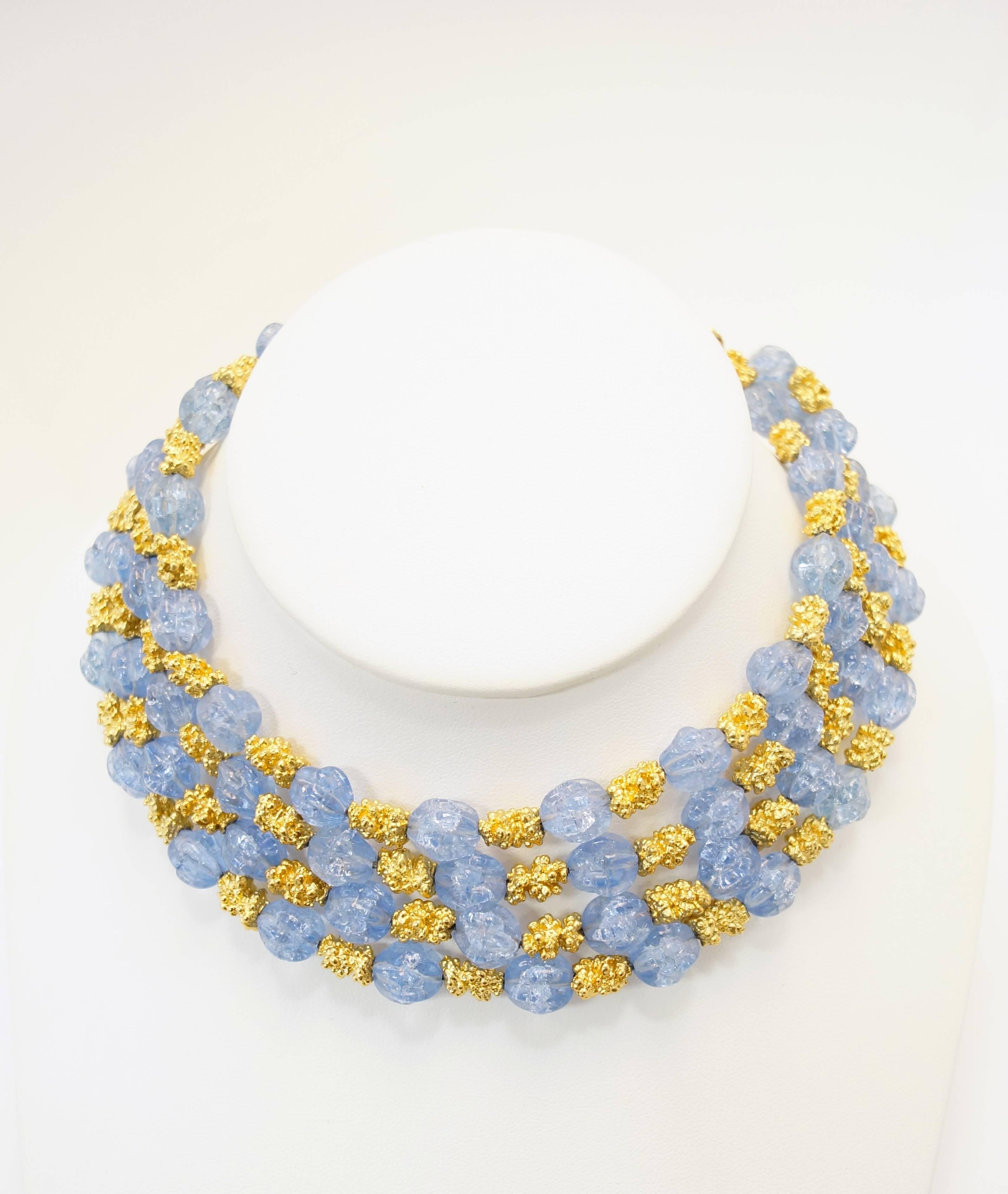 
Gorgeous gold and cornflower blue parure by Trifari! Excellently preserved for almost 70's years. 

This parure consists of a necklace, bracelet, and earrings. The four strand necklace is composed of alternating gold tone nugget beads and
