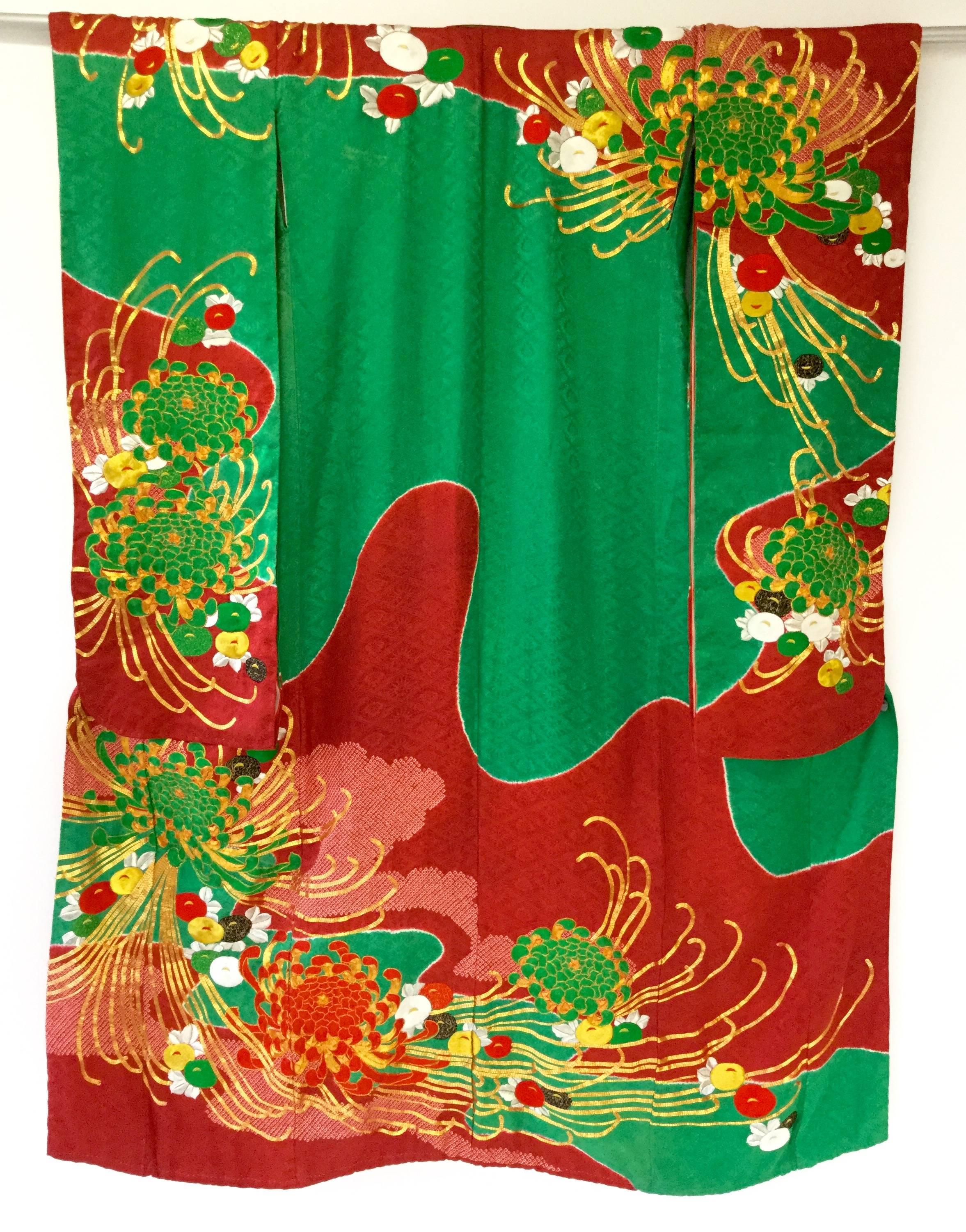 
Absolutely striking! The Uchikake kimono is a formal kimono coat work worn only by brides or by stage performers. 

This particular piece could have served as either a wedding kimono or a performance kimono because of its color and motif. This