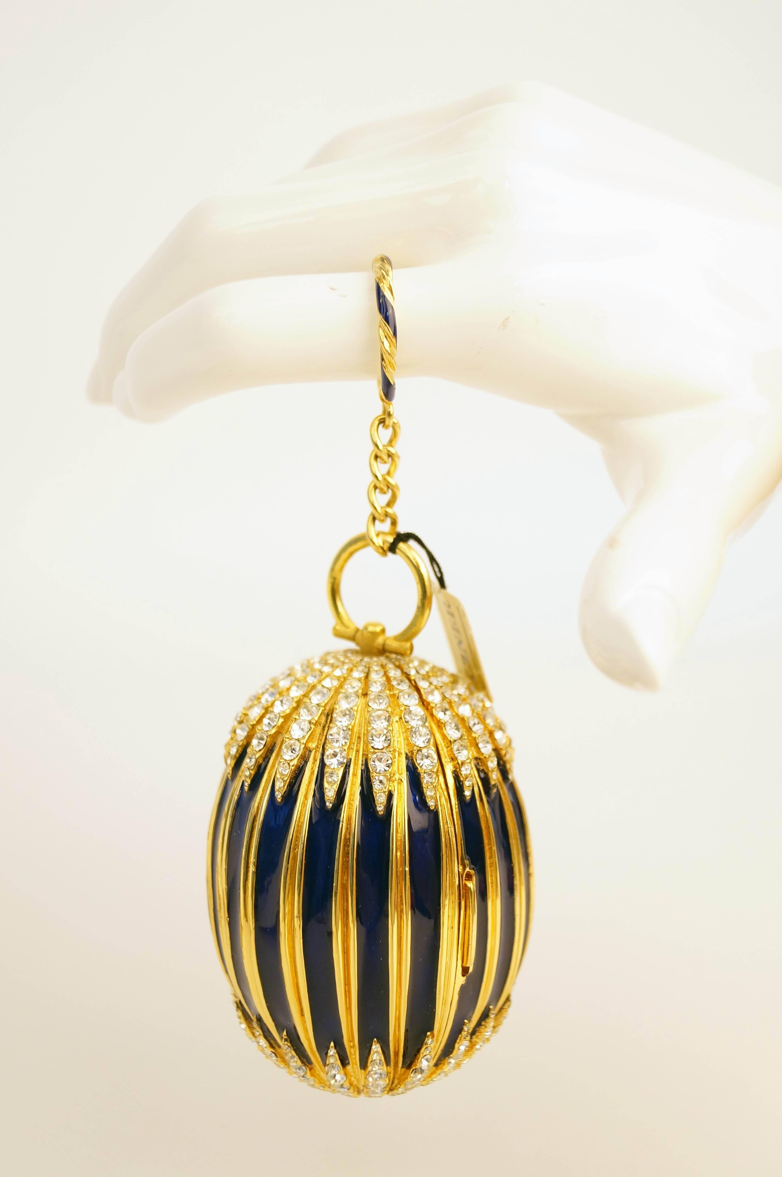 Perfect Timing!  In honor of its 125th annversary, Ciner has just released an Egg Minaudiere to celebrate it as one of Ciner's most coveted and hard to find designs.  We are offering an original. 
 
In addition, this gorgeous minaudiere was owned by
