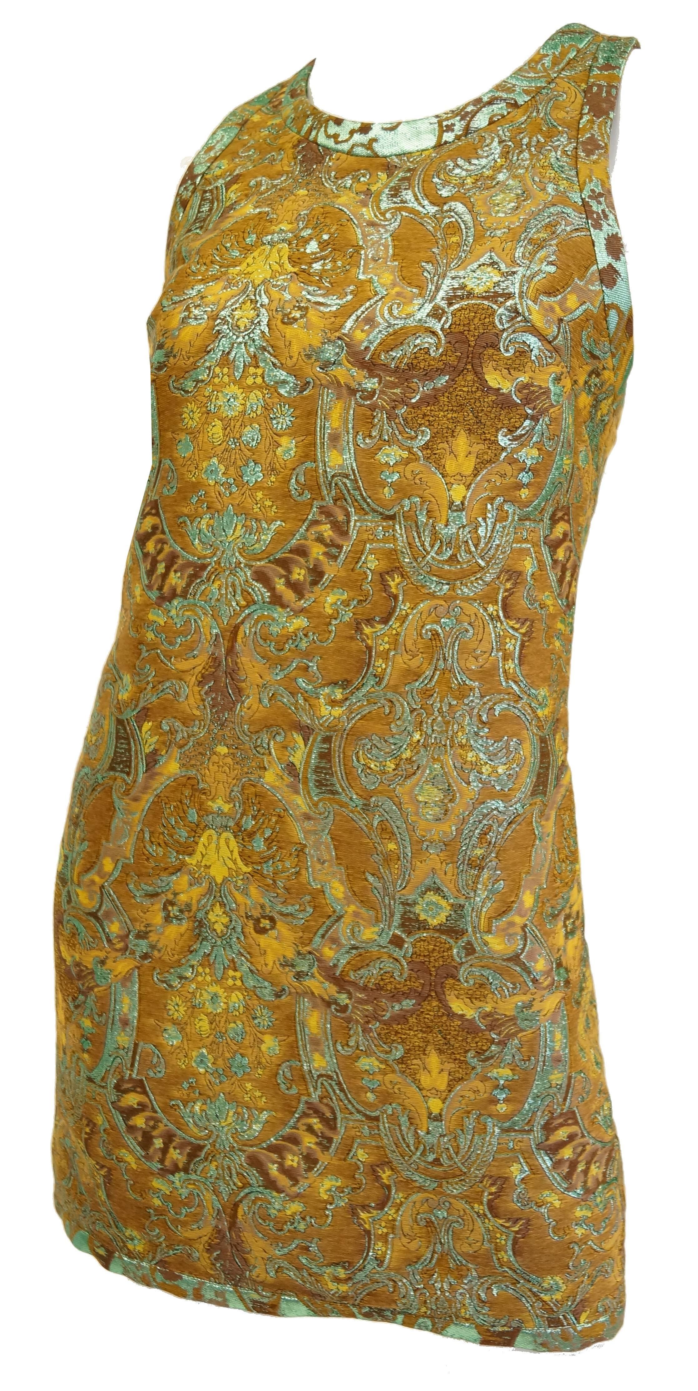 This jacquard dress by Barbara Bui is fantastic! The above the knee length shift dress is sleeveless with narrow straps and a high, round neckline, giving it a halter - like appearance. The traditional all - over jacquard print on the dress is