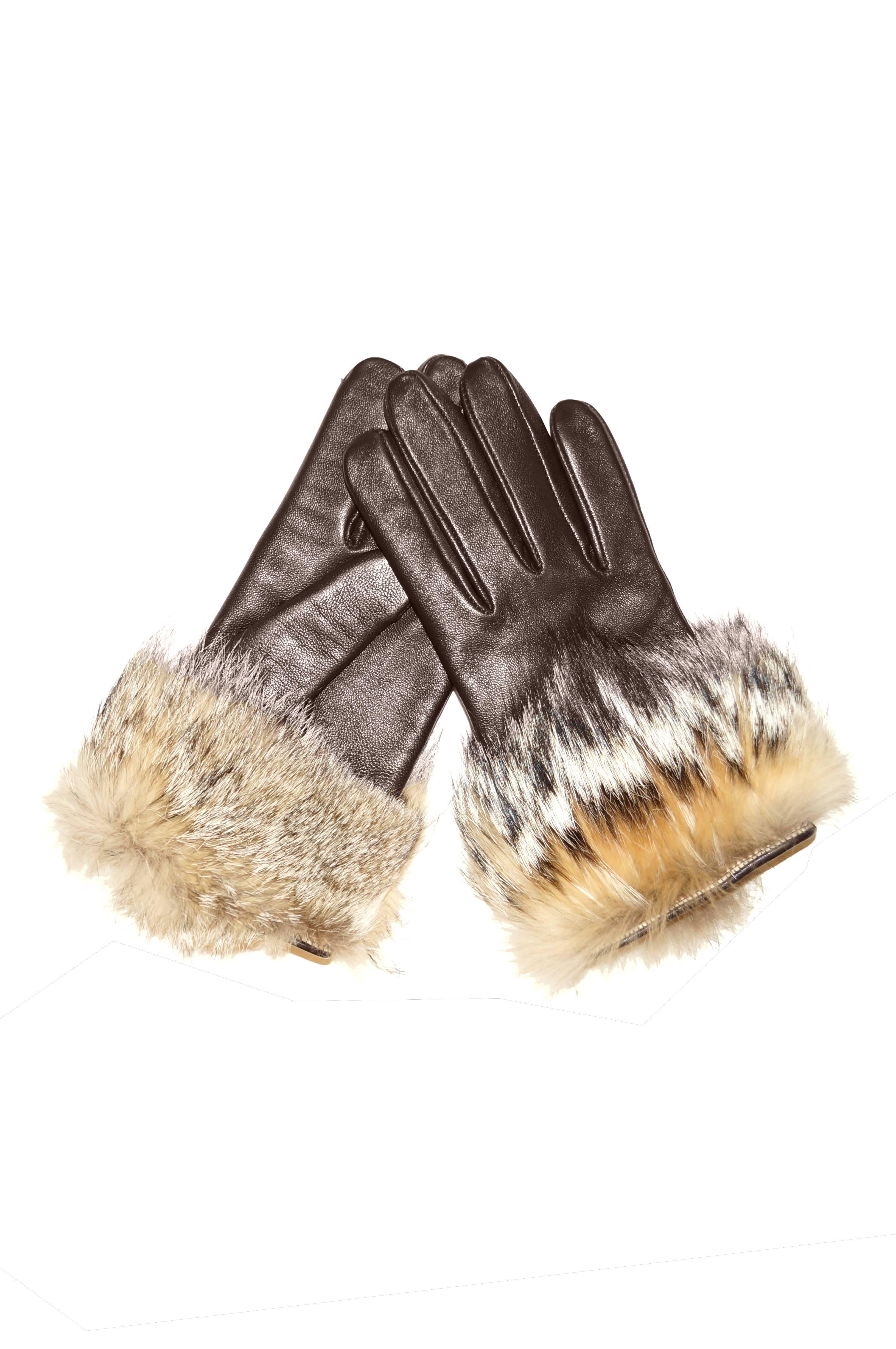 So soft, so supple, so warm! Glorious pair of russet brown gloves with almond rounded finger tips. The gloves come up to just above the wrist and feature a thick band of “raccoon dog”  fur on the cuff. The fur has a cream-colored base with warm grey