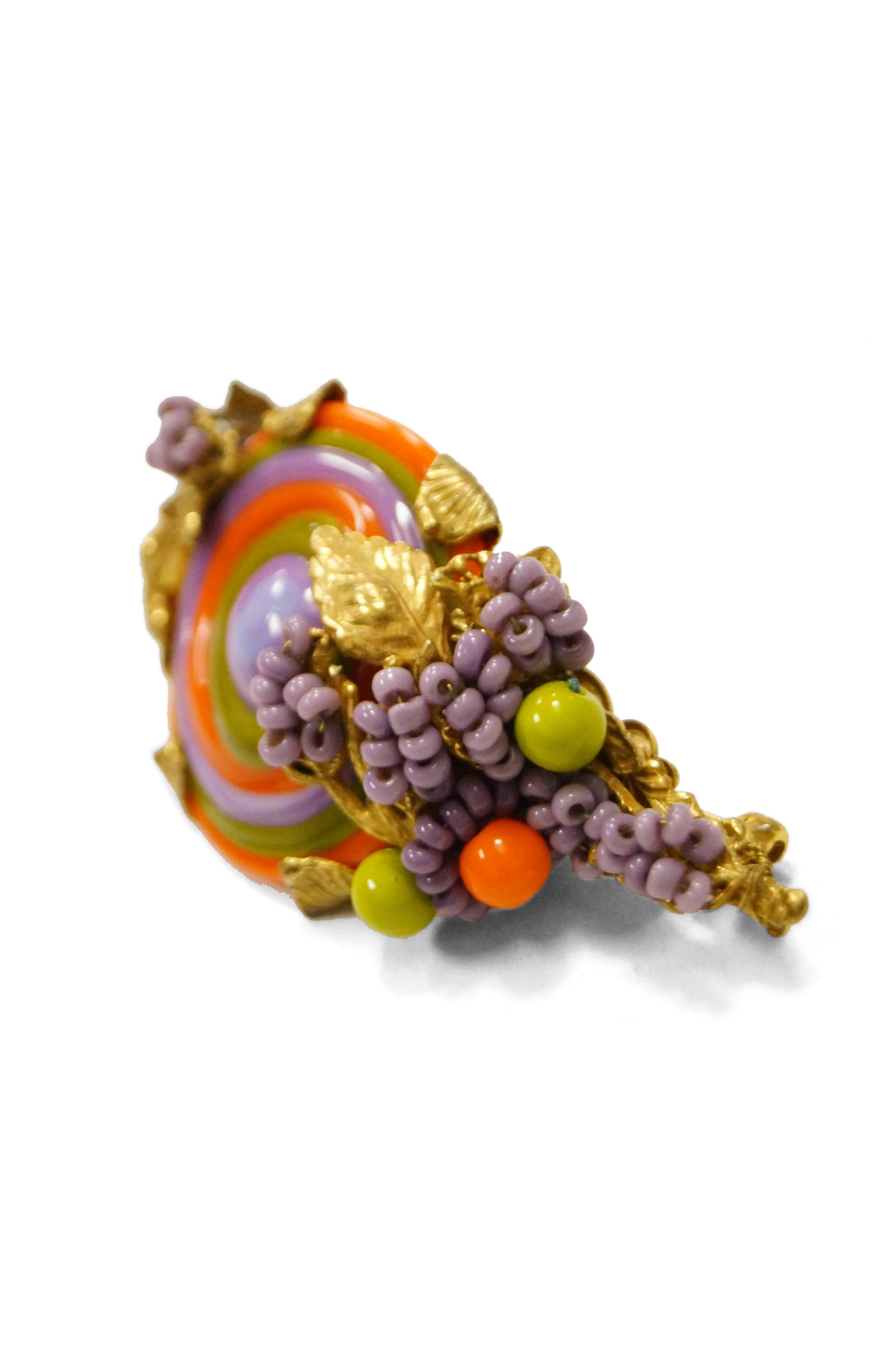 Beautiful colorful swirling demi parure by Miriam Haskell! This set is considered rare in both the type of poured glass (multi - colored swirls) and the choice and combination of colors!  This swirling orange, purple, and green (very 60s color