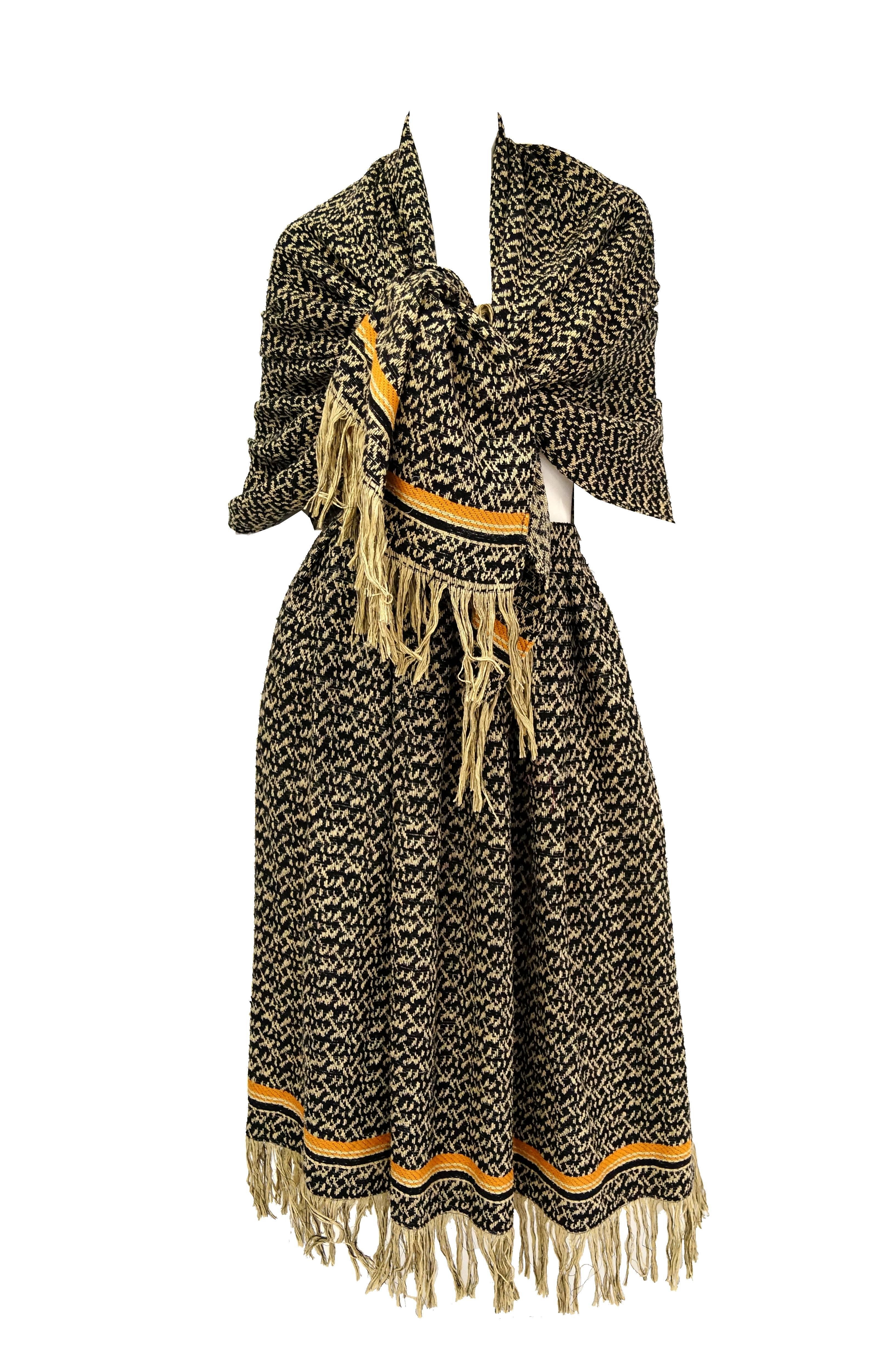 Beautiful woven skirt and matching shawl in black and beige! This ensemble features a midi a - line skirt with gathered waist and wide waist band, as well as a wide, rectangular shawl. Skirt and shawl are in matching abstract repeating weave pattern