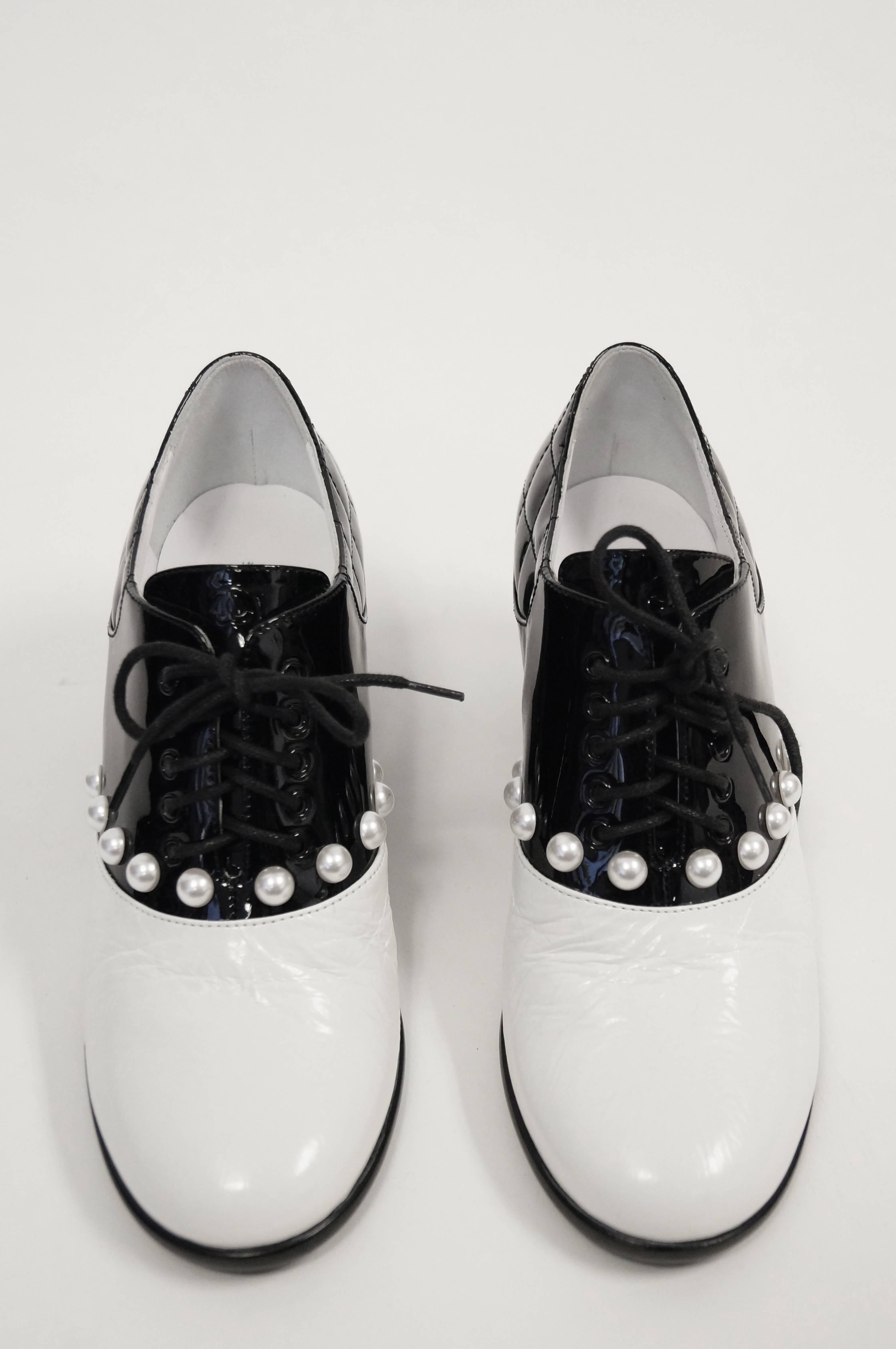 Iconic Chanel glossy patent leather black and white oxfords from the Pre-Fall 2014 
