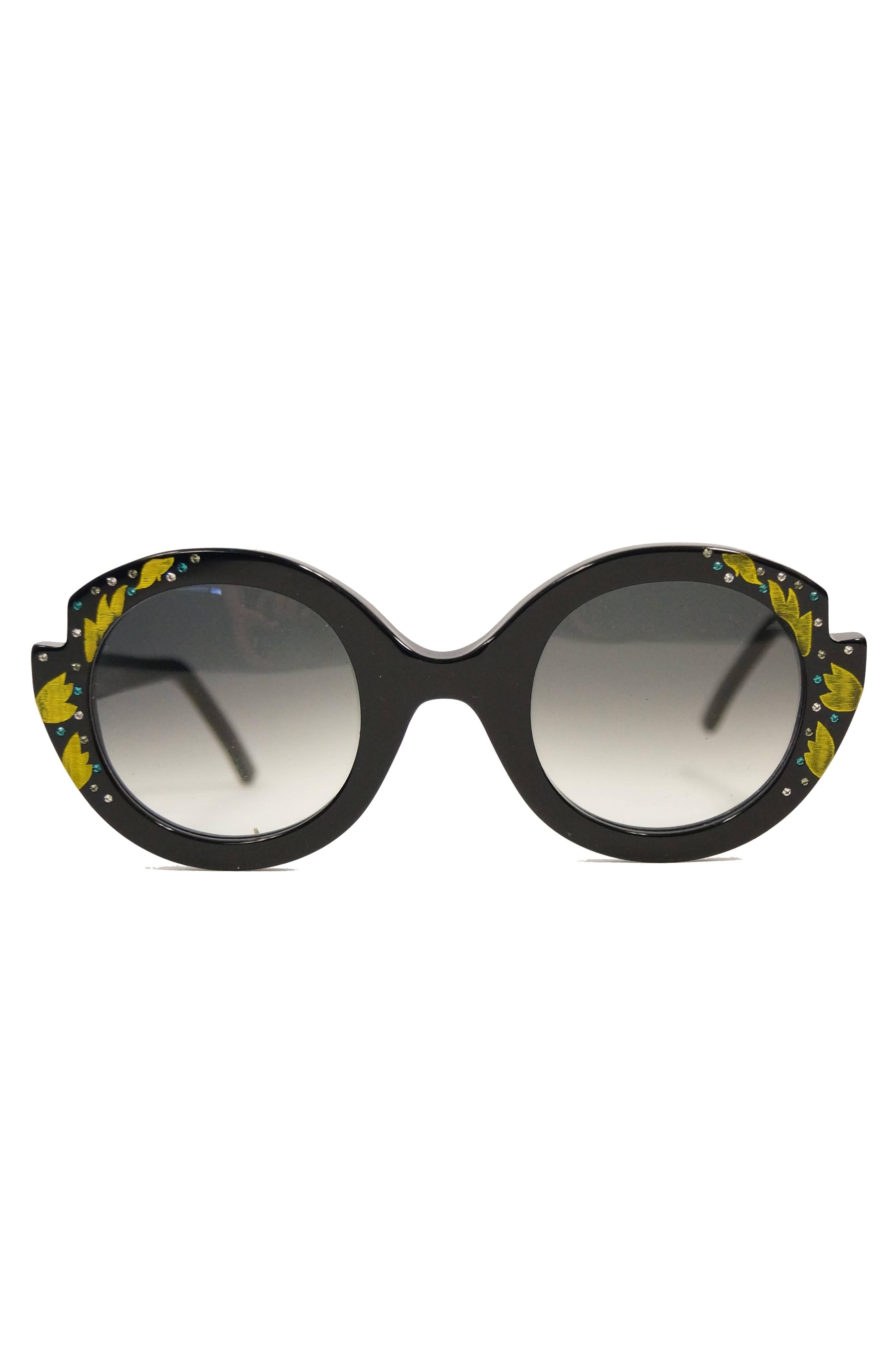 Limited Edition Frances Klein sunglasses!  Elegant and oversized circular floral glasses handmade and handpainted in France The glasses have large smoky rounded lenses with a black frame featuring notched details above where the temples connect to