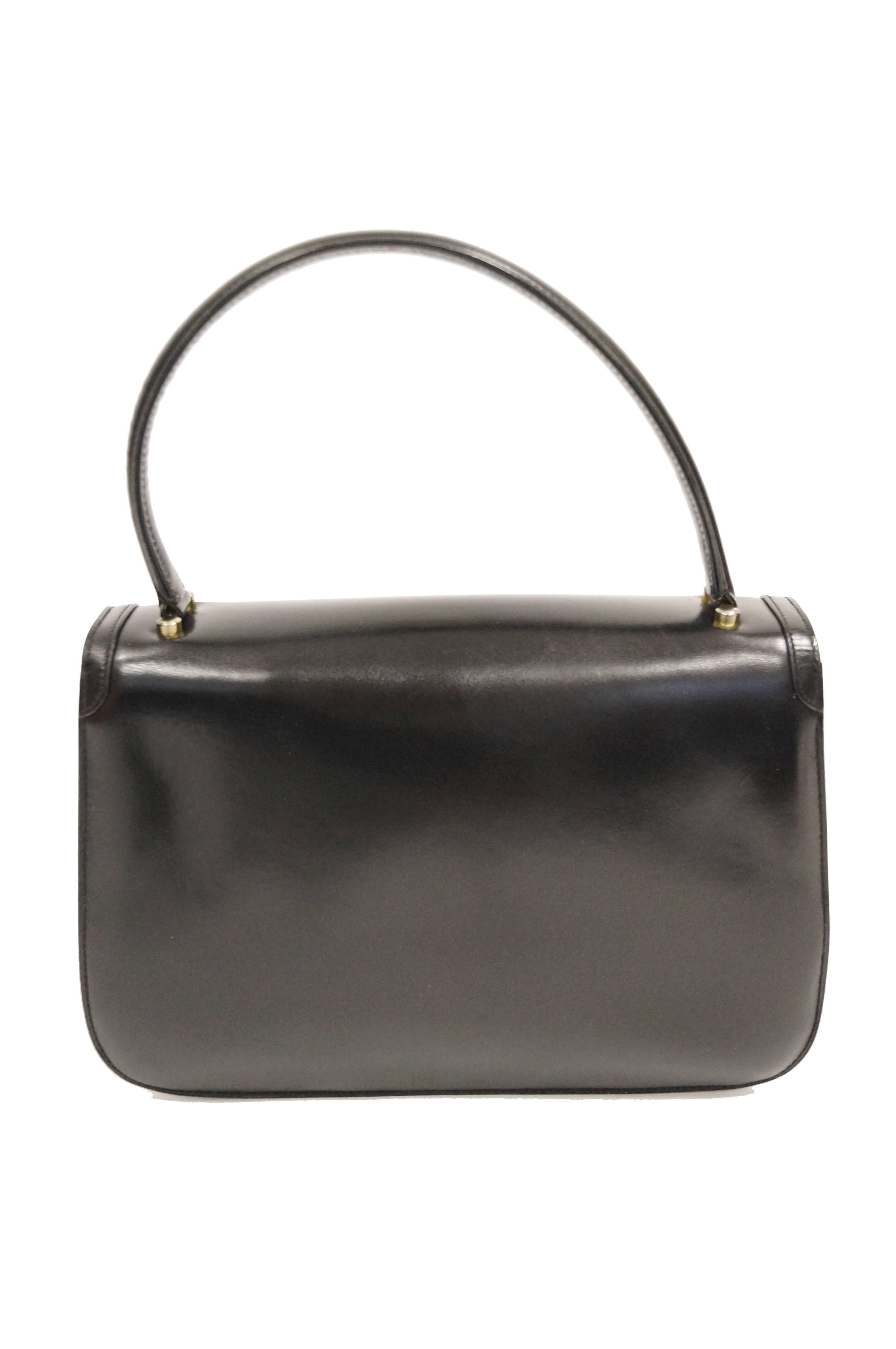 Women's 1960s Gucci Black Leather Top Handle Handbag with Crescent Lock 