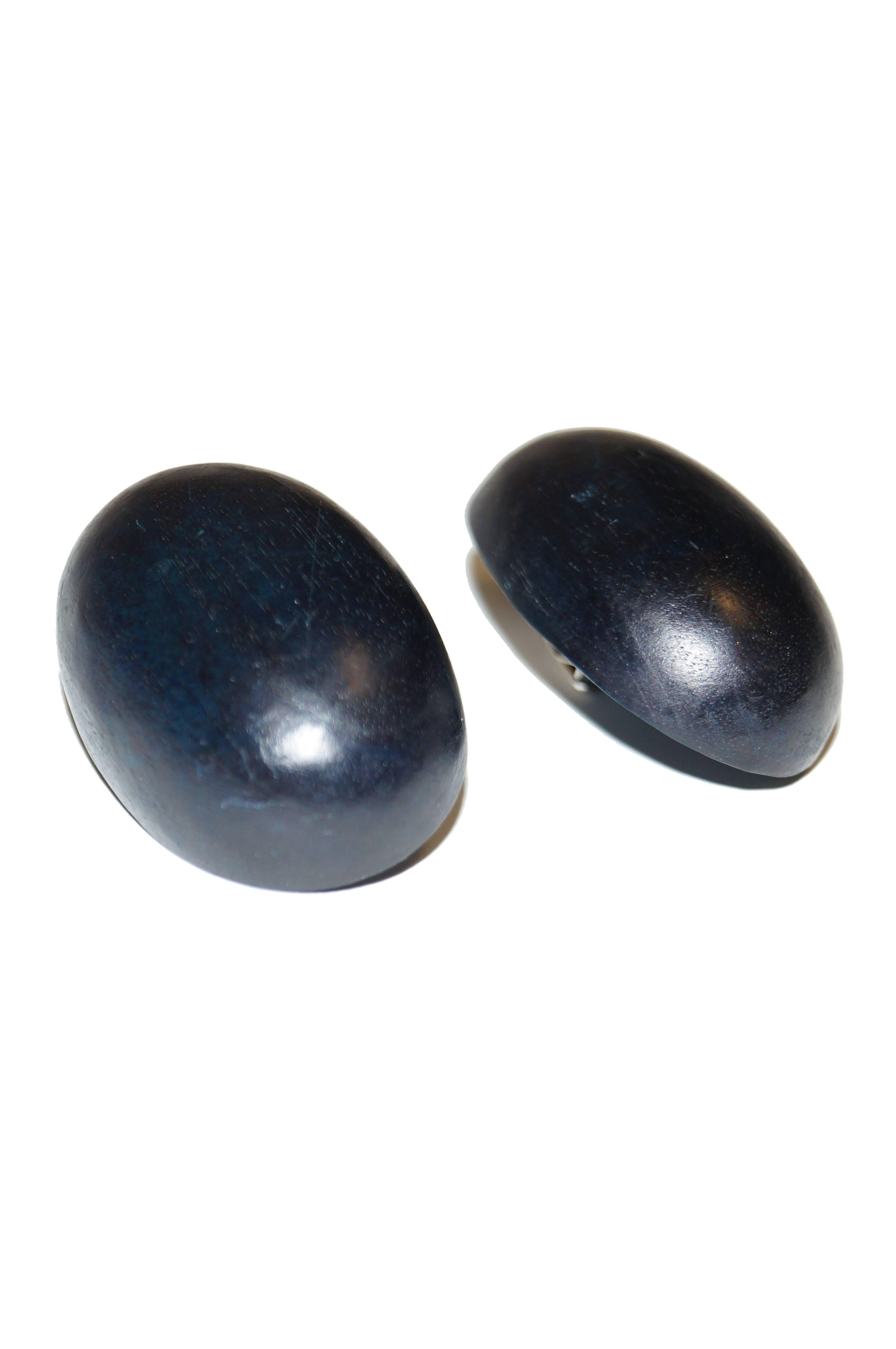 Oversized oval clip-back carved wood earrings by Monies! The earrings are large semi-ovals with a smooth black - blue shift finish. Flat backside. Monies label on tag on reverse.

Monies was founded in 1973, by Gerda (nee Gerda Lynggaard) and