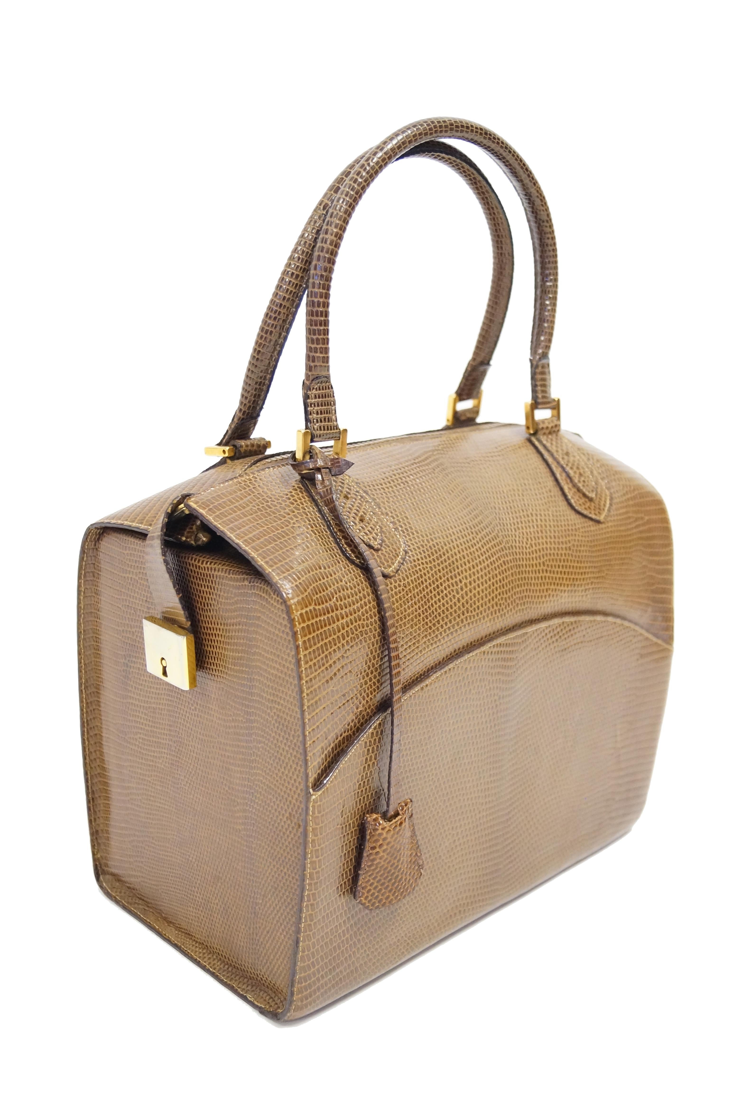 Wonderful structured chestnut brown Java lizard skin bag by Martin Van Schaak. This custom - made handbag with handles on  is somewhat reminiscent of the traditional doctor bag, with two top handles with a zippered opening in between. The exterior